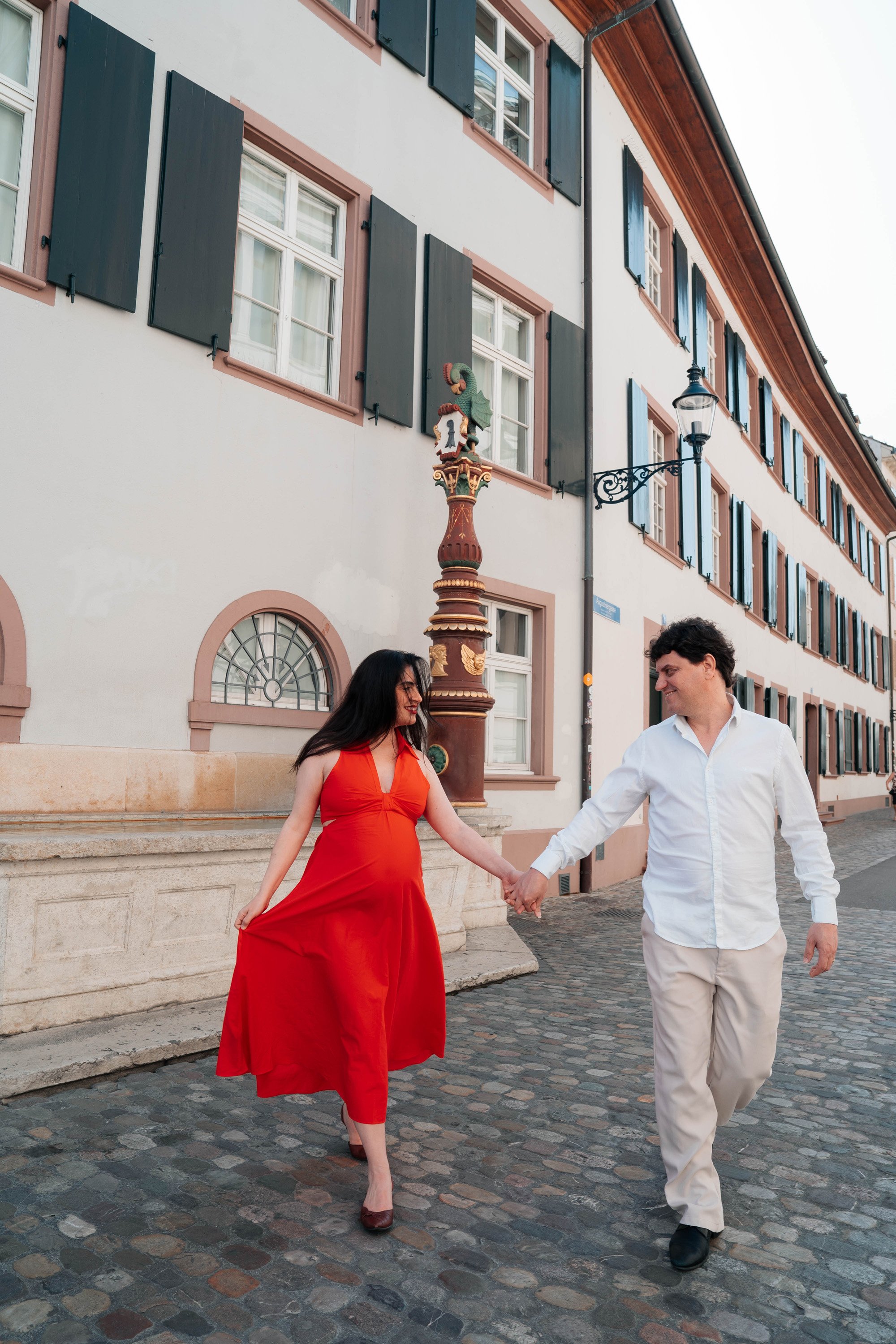Maternity photoshoot strolling through Basel’s colorful old town streets.
