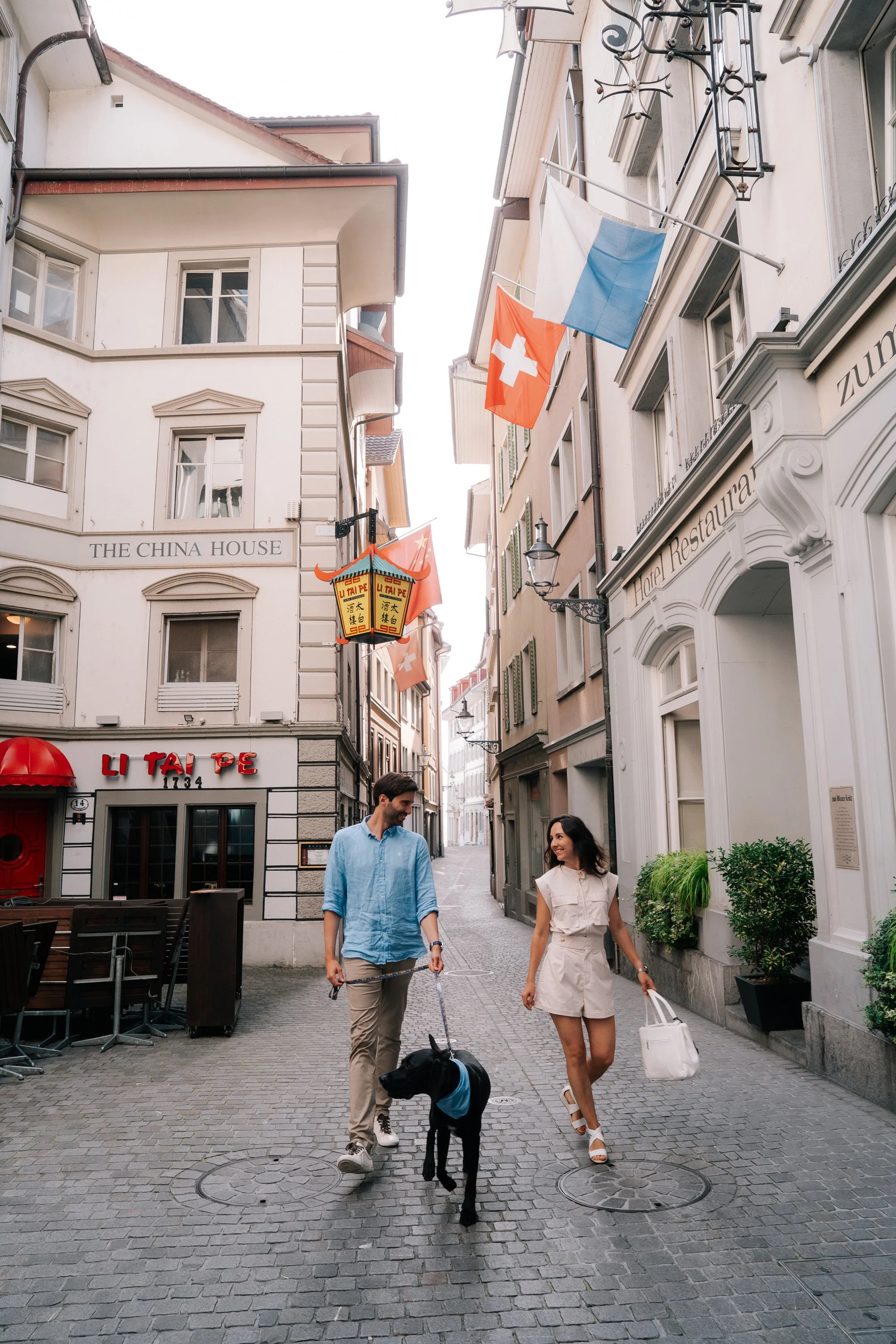 Couple Walking Through Lucerne with Dog | Switzerland Vacation Photography