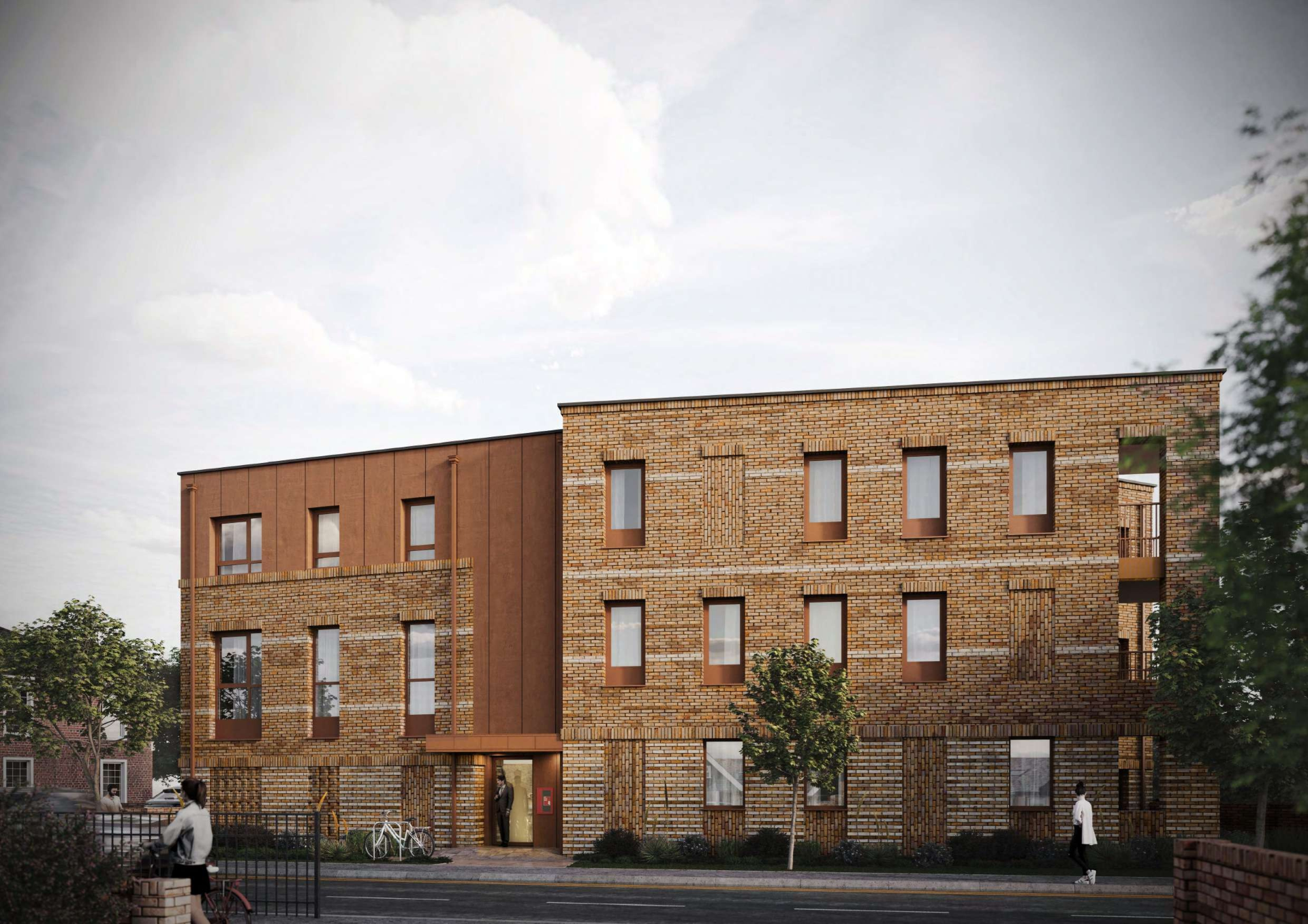 A modern brick apartment building with multiple windows and balconies, greenery in the garden, and a person on the rooftop.