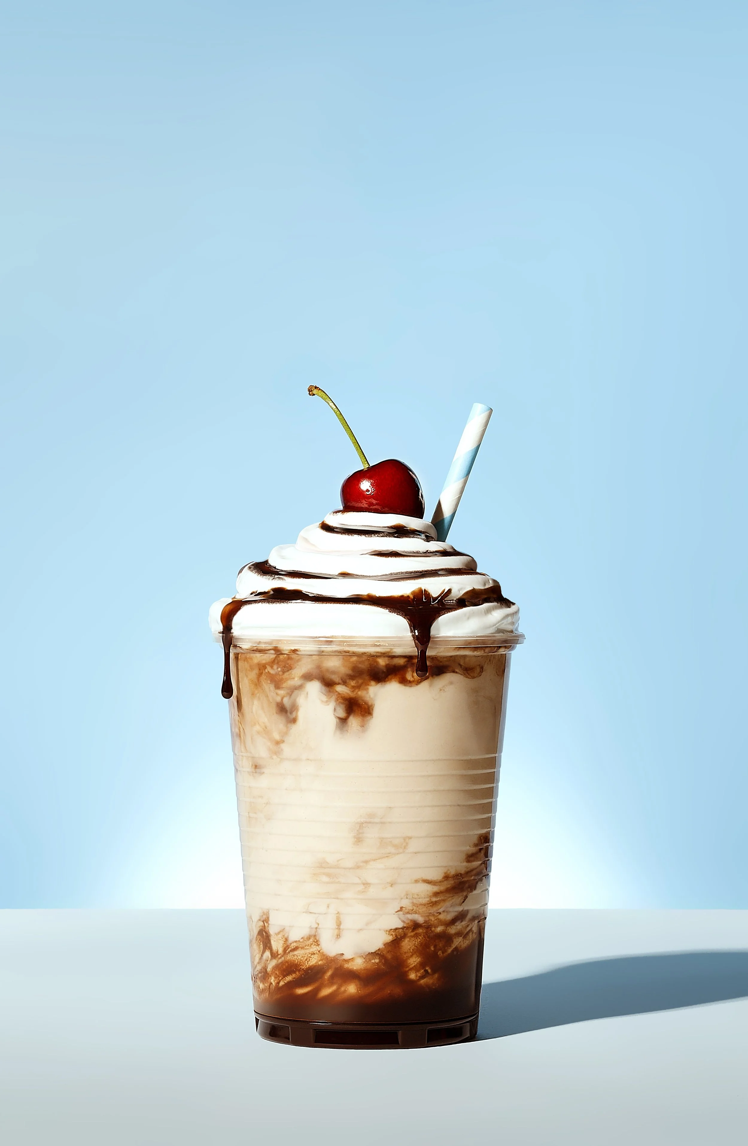 Sarah Ghijselinck, food and drink stylist, Gent, Chocolate and vanilla swirl milkshake, a cherry on top, and a straw.