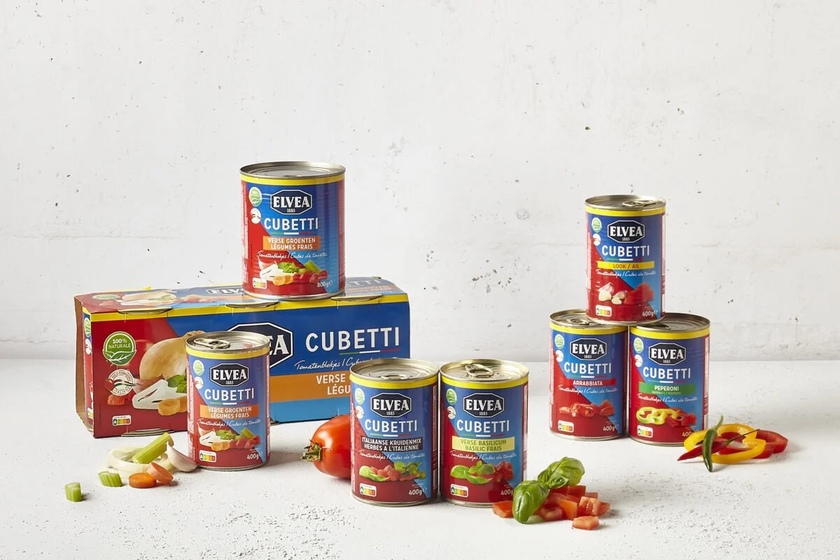 Sarah Ghijselinck, food and drink stylist, art direction, recipe development, Gent, product photography, Cans of Elvea Cubetti, including tomatoes, peppers, basil, and onions.