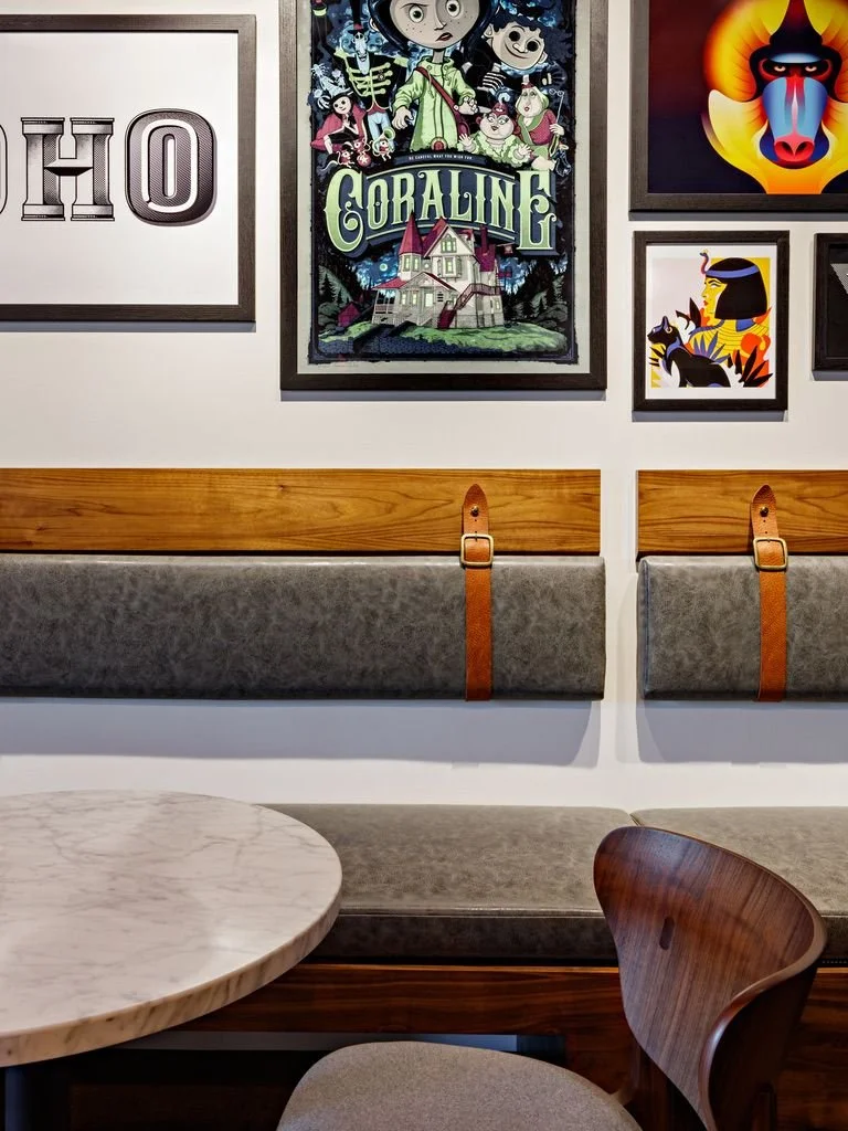 A leather and wood banquette close up installed in a modern cafe