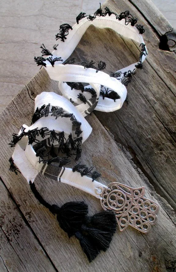 Unique long necklace, tasseled Keffiyeh stripe adorned with the attention-grabbing Hand of Fatima metal big charm