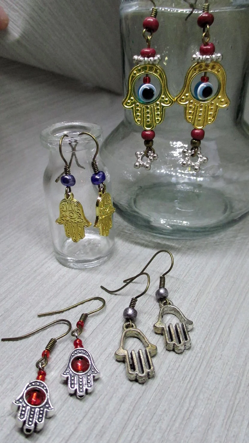 Best value for price, group of 4 earrings adorned with the interesting Hand of Fatima charm, every earring is unique