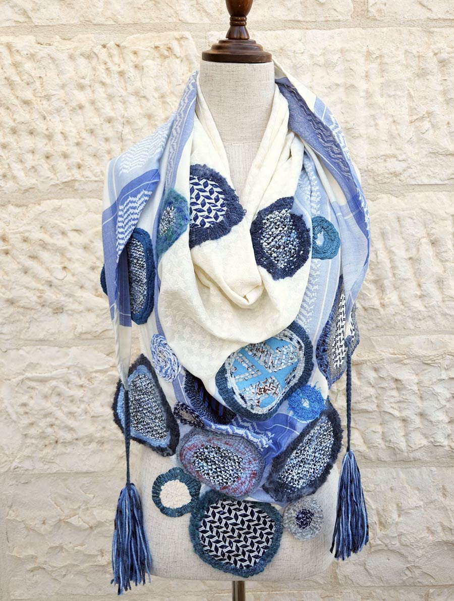 This captivating collection is fusion of colors, patterns, textiles. All played together to create this alluring scarf. Orbs beautifully arranged on a Keffiyeh fabric