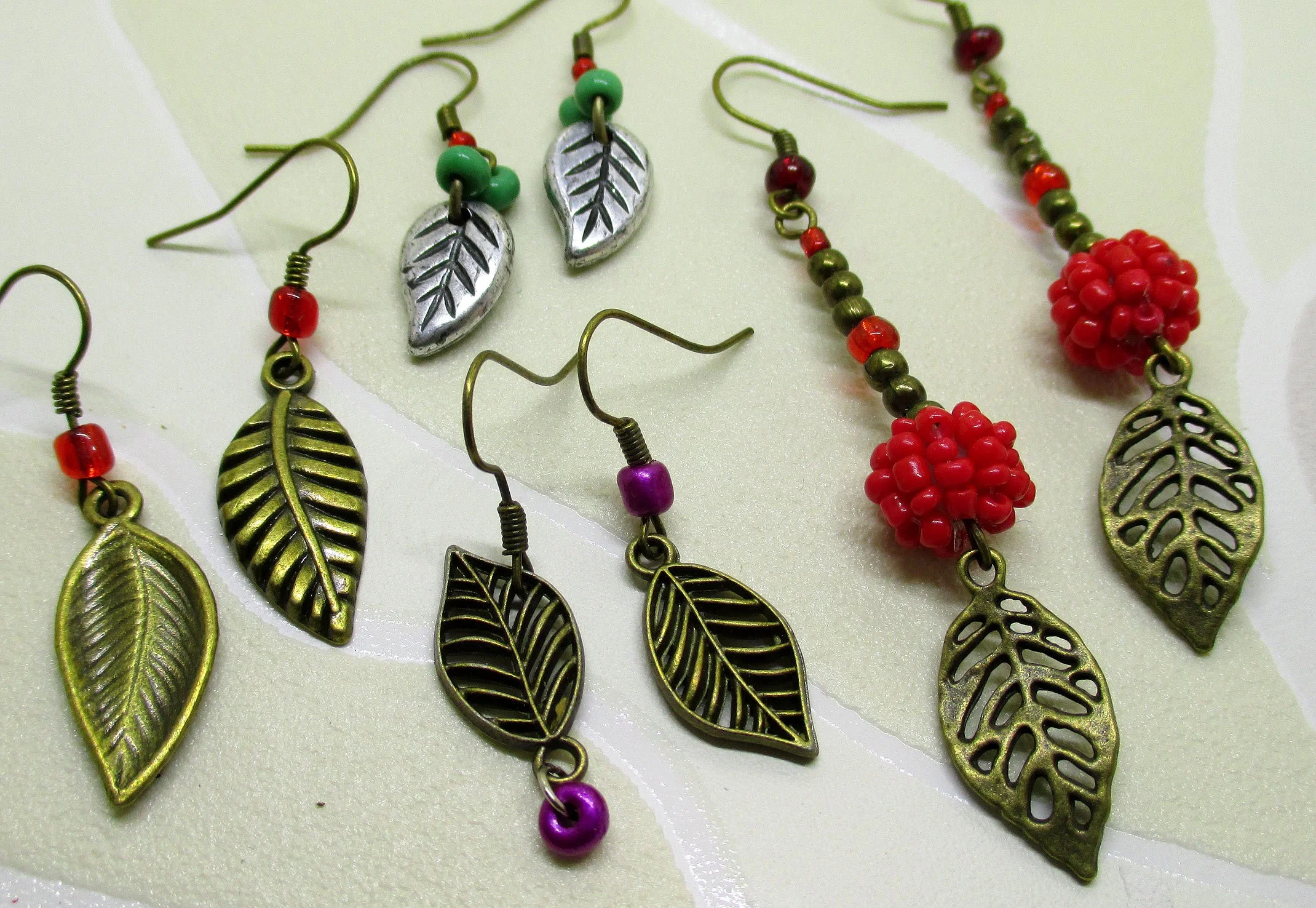 Best value for price, group of 4 earrings adorned with leaf charm, every earring is unique (Copy)