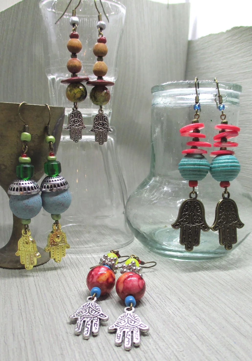 Best value for price, group of 4 earrings adorned with the interesting Hand of Fatima charm, every earring is unique
