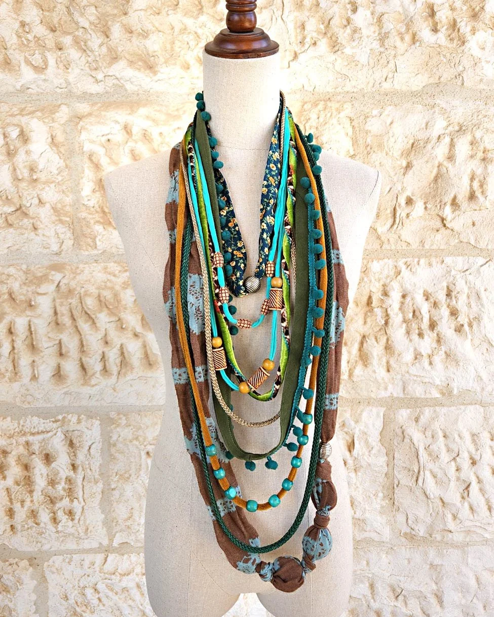 Trendy women's large multi-layered fabric necklace create from many textiles and ropes with lots of beads , it's a statement piece of art