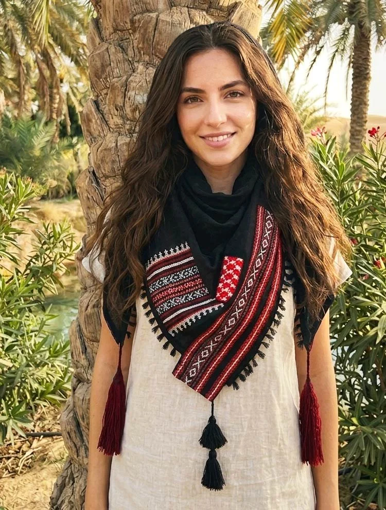Wrap yourself in a piece of living heritage with this Keffiyeh scarf, beautifully adorned with authentic Sadu fabric patches