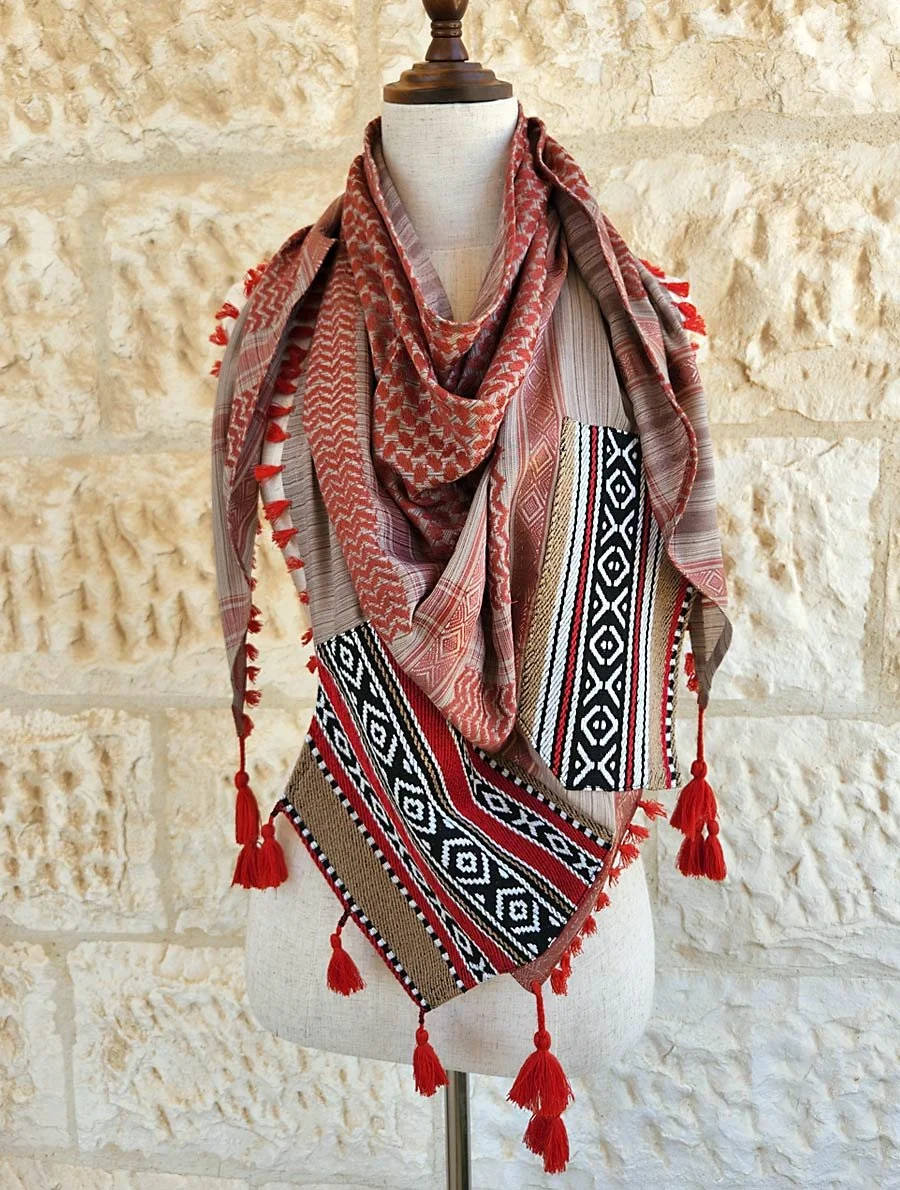 Handmade Keffiyeh scarf with Sadu fabric, inspired by traditional Bedouin weaving. Features geometric desert motifs, soft texture, and artisanal tassels