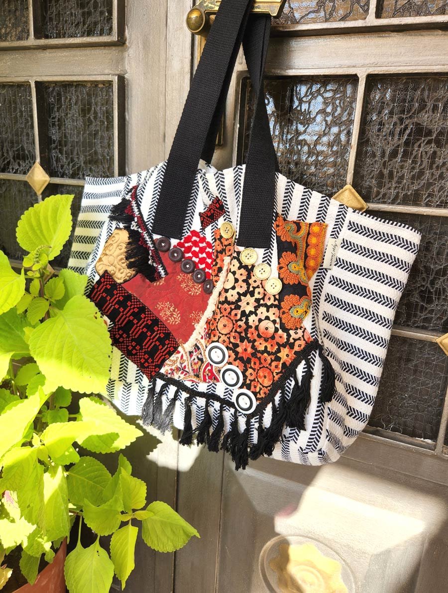 Wearable work of art. Each piece in this Totes collection is a handmade one-of-a-kind piece, denim fabric and a variety of richly textiles, patterned fabrics