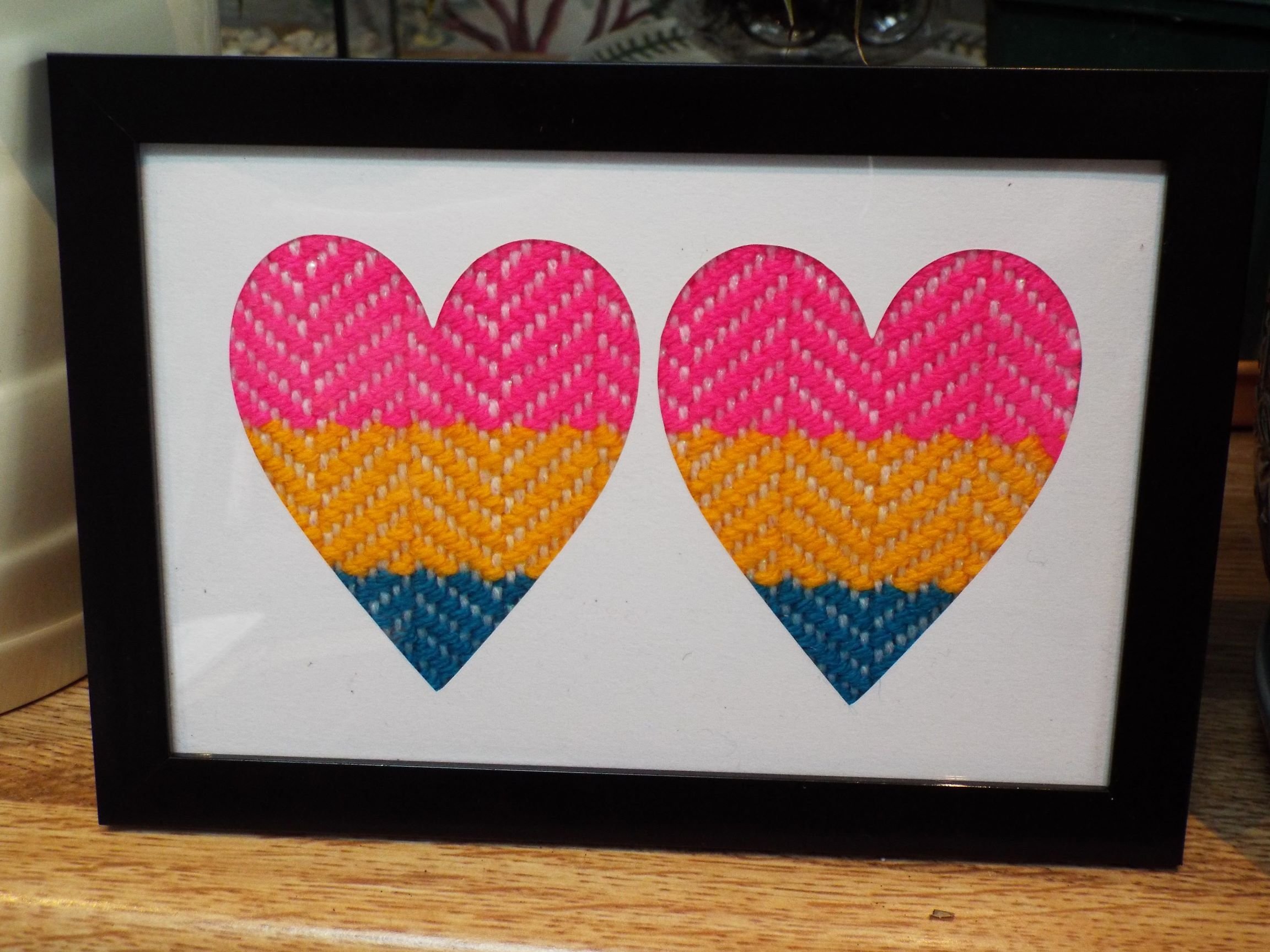 Framed Pride flag: Twin hearts
