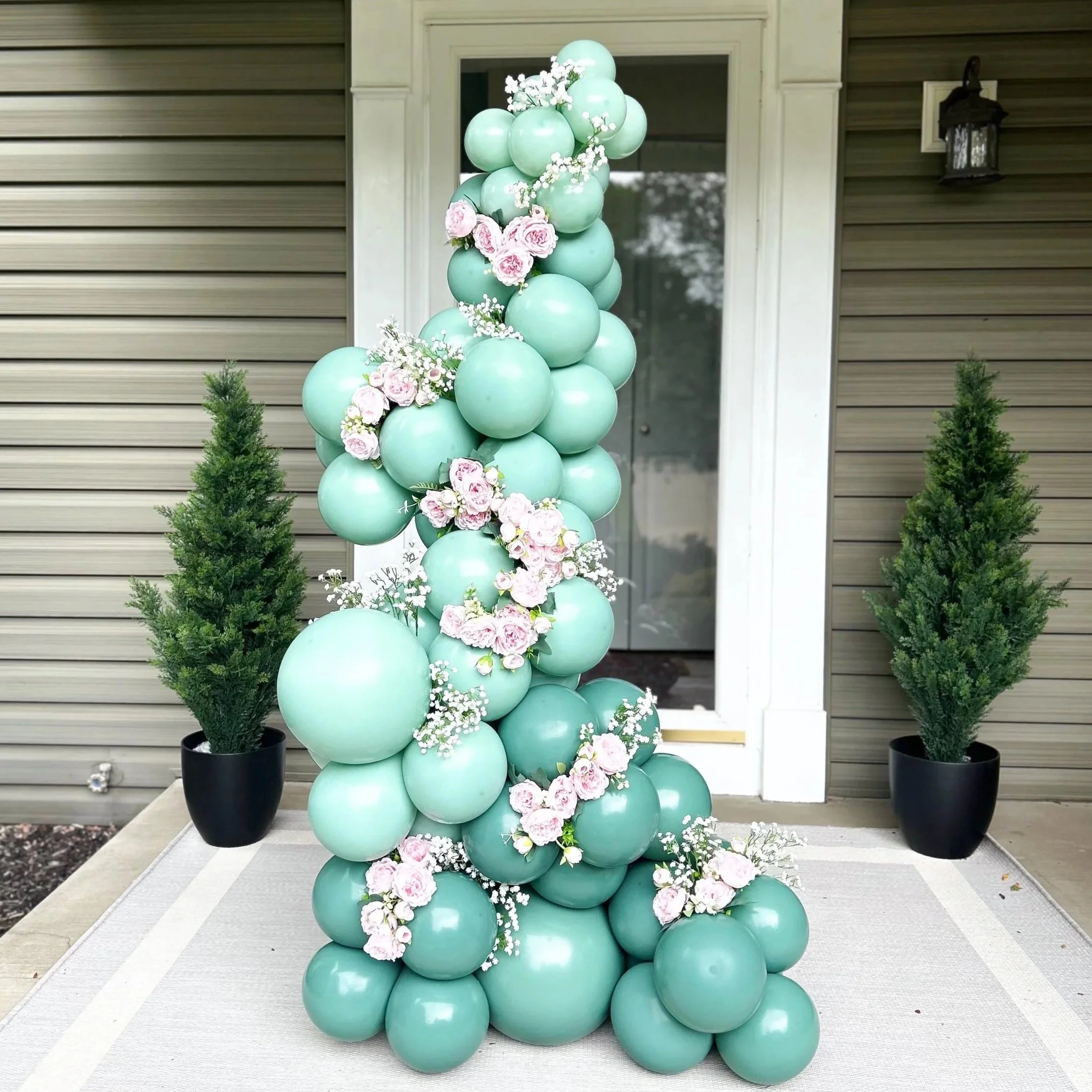 Organic free standing balloon garland installation, ideal for creating memorable focal points in Cleveland, OH events.