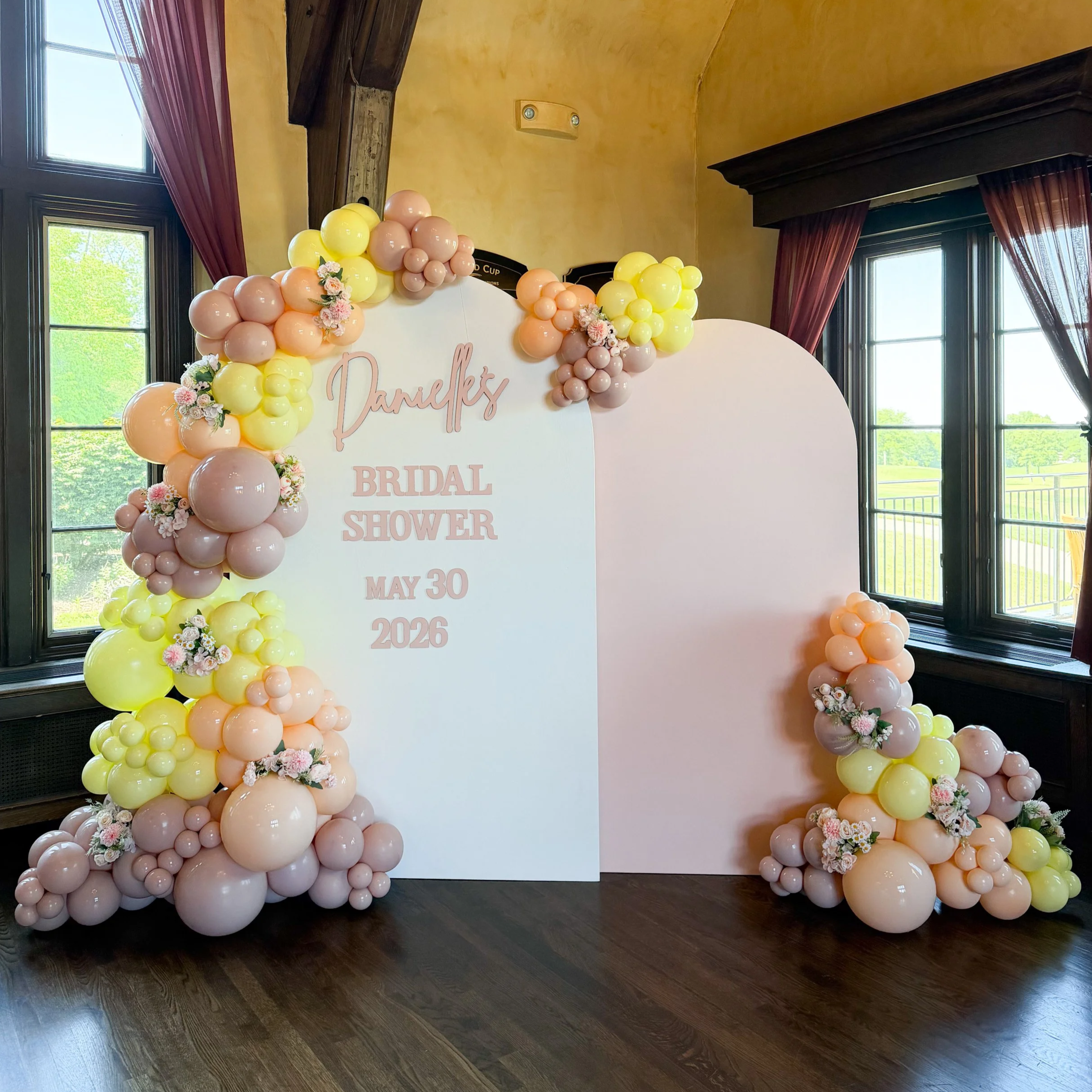 Bridal shower balloon decor with two custom backdrops and organic balloon garlands in Cleveland, Ohio.