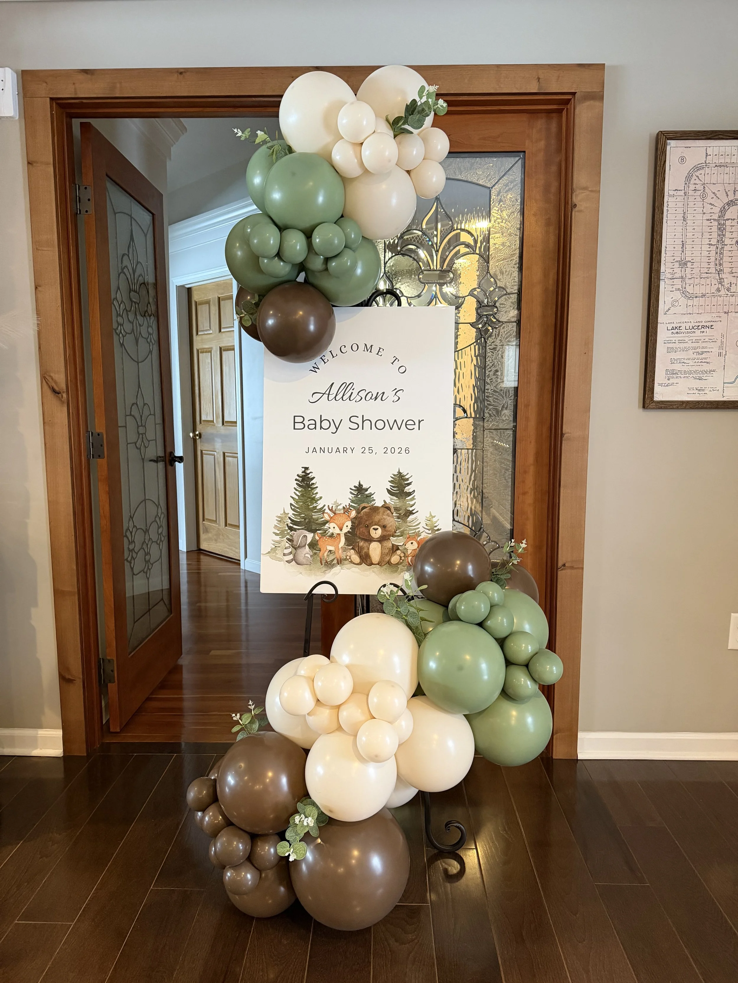 Unique organic balloon garland with easel display for events in Hudson, providing a stylish and memorable presentation.
