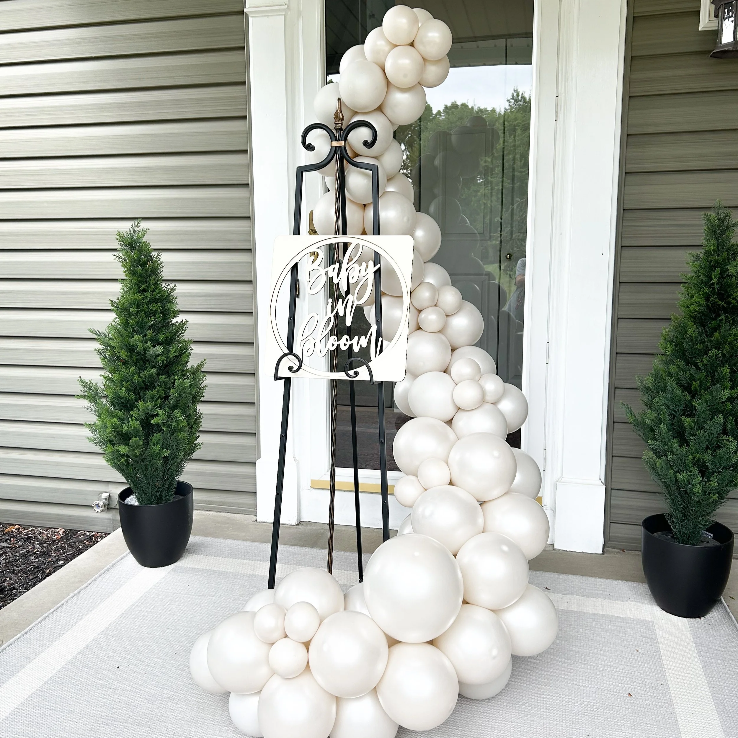 Organic balloon garland designed to create a welcoming and elevated event entrance experience.