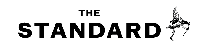 A dark image with a faint outline of a bird in the top right corner.