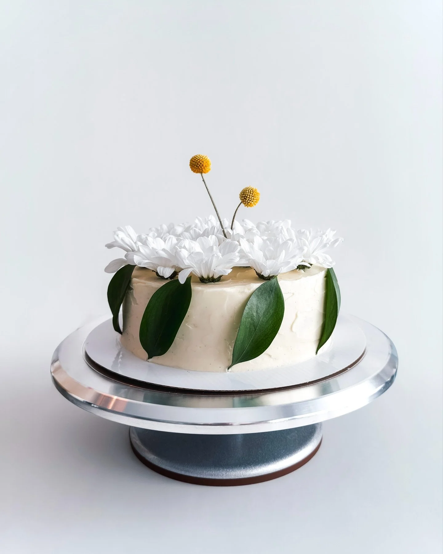 sweet and simple (2nd) birthday cake :&rsquo;))

brown butter base cake with miso caramel layers - white daisies and yellow craspedia stems to top it all off