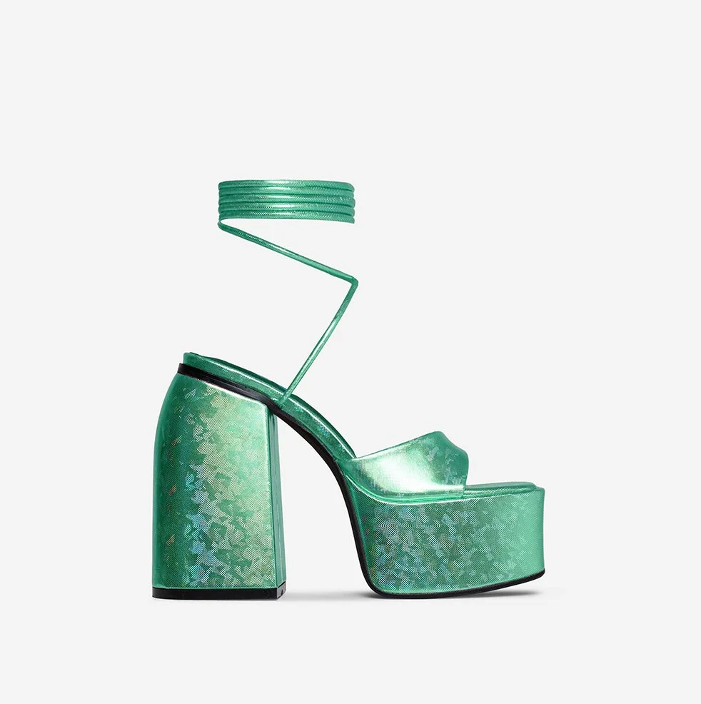 Fashionable green high-heeled sandal with an ankle cuff and block heel.