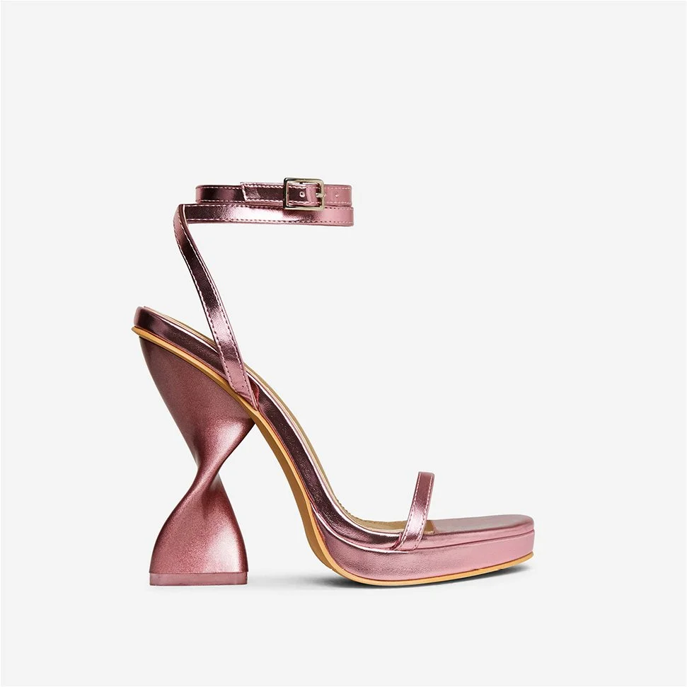 Pink metallic high-heeled sandal with a chunky, twisted heel and an ankle strap with a buckle.