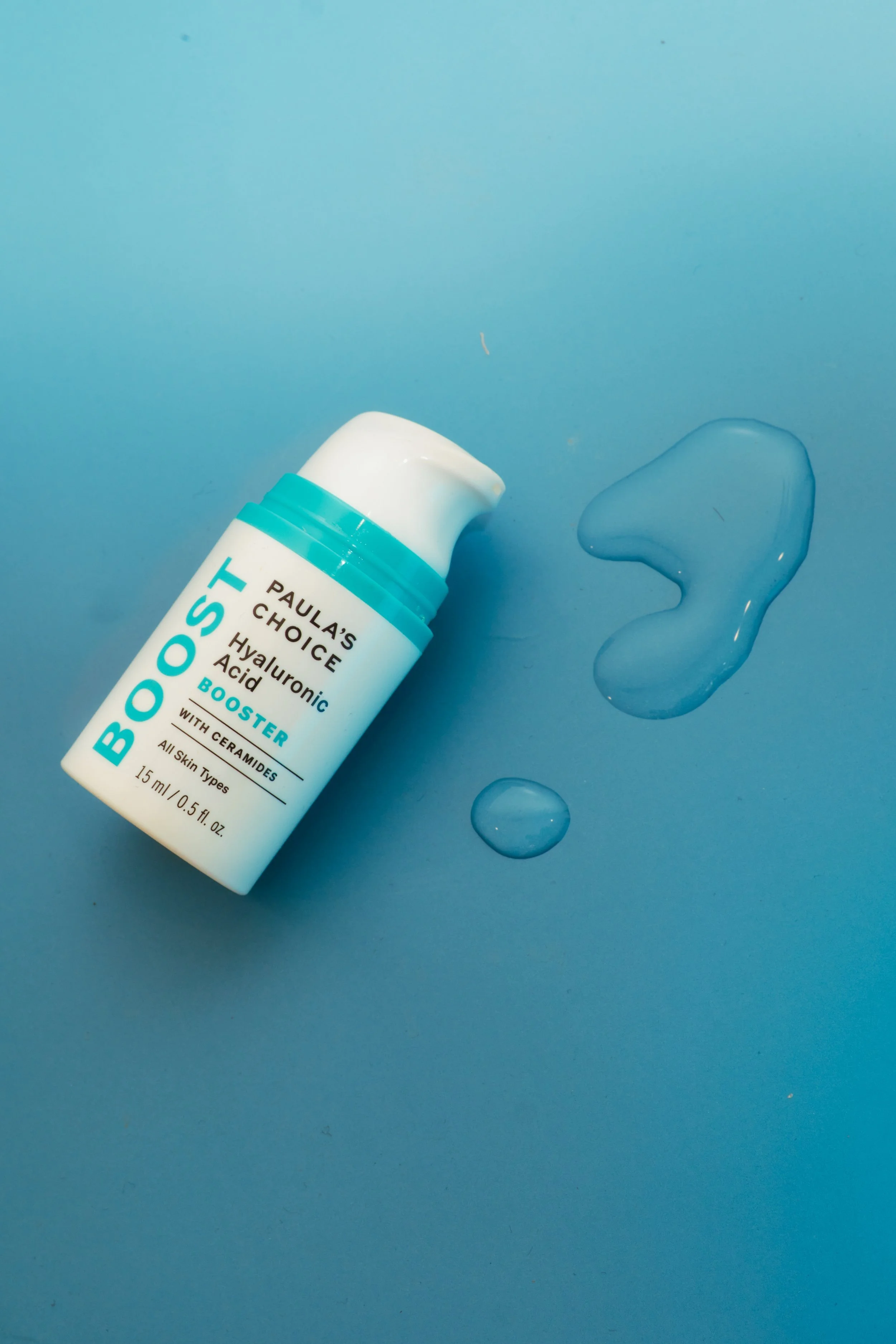  JSnaps Product Photography E-commerce Commercial Photography New York City. Skincare on blue background with water droplets