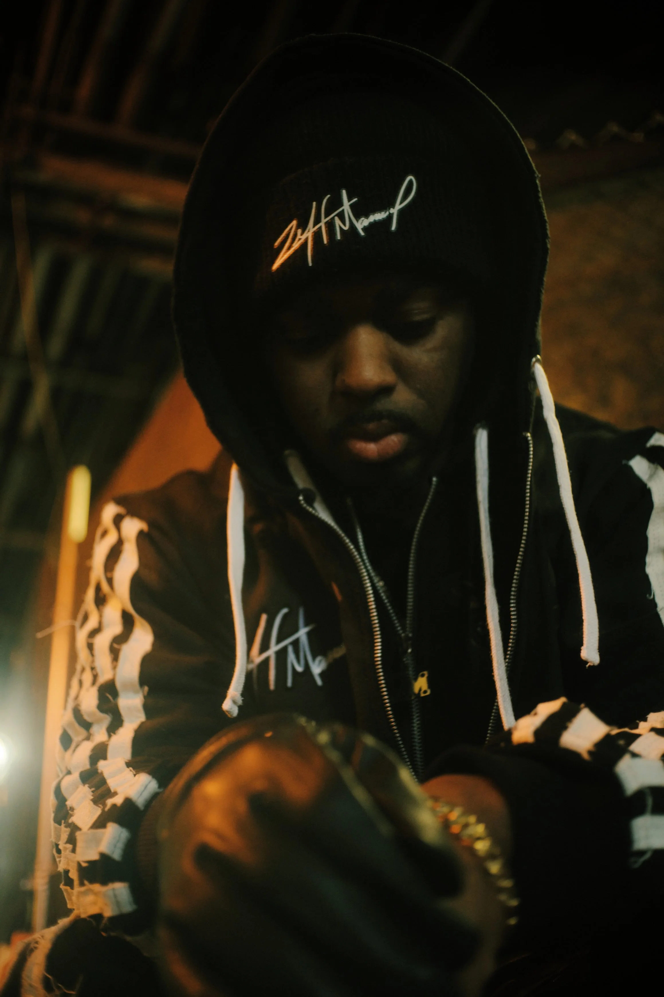 A man in a dark hooded sweater at a NYC subway station. JSnaps Photography New York City Fashion lifestyle photography 