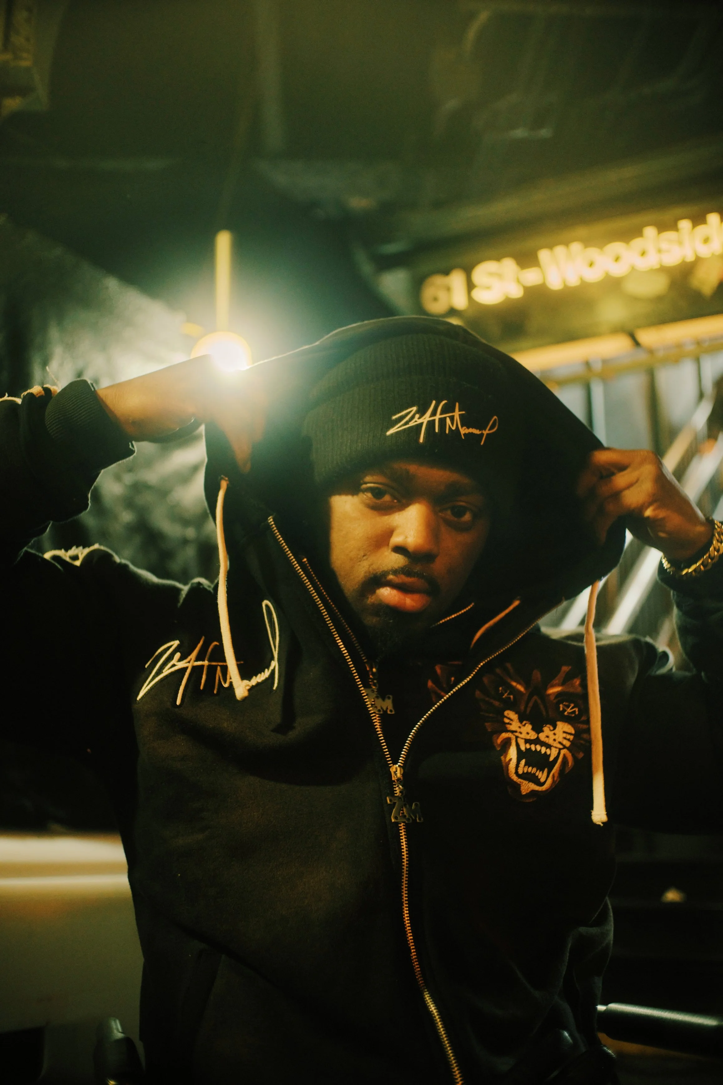 A man in a dark hooded sweater at a NYC subway station. JSnaps Photography New York City Fashion lifestyle photography 