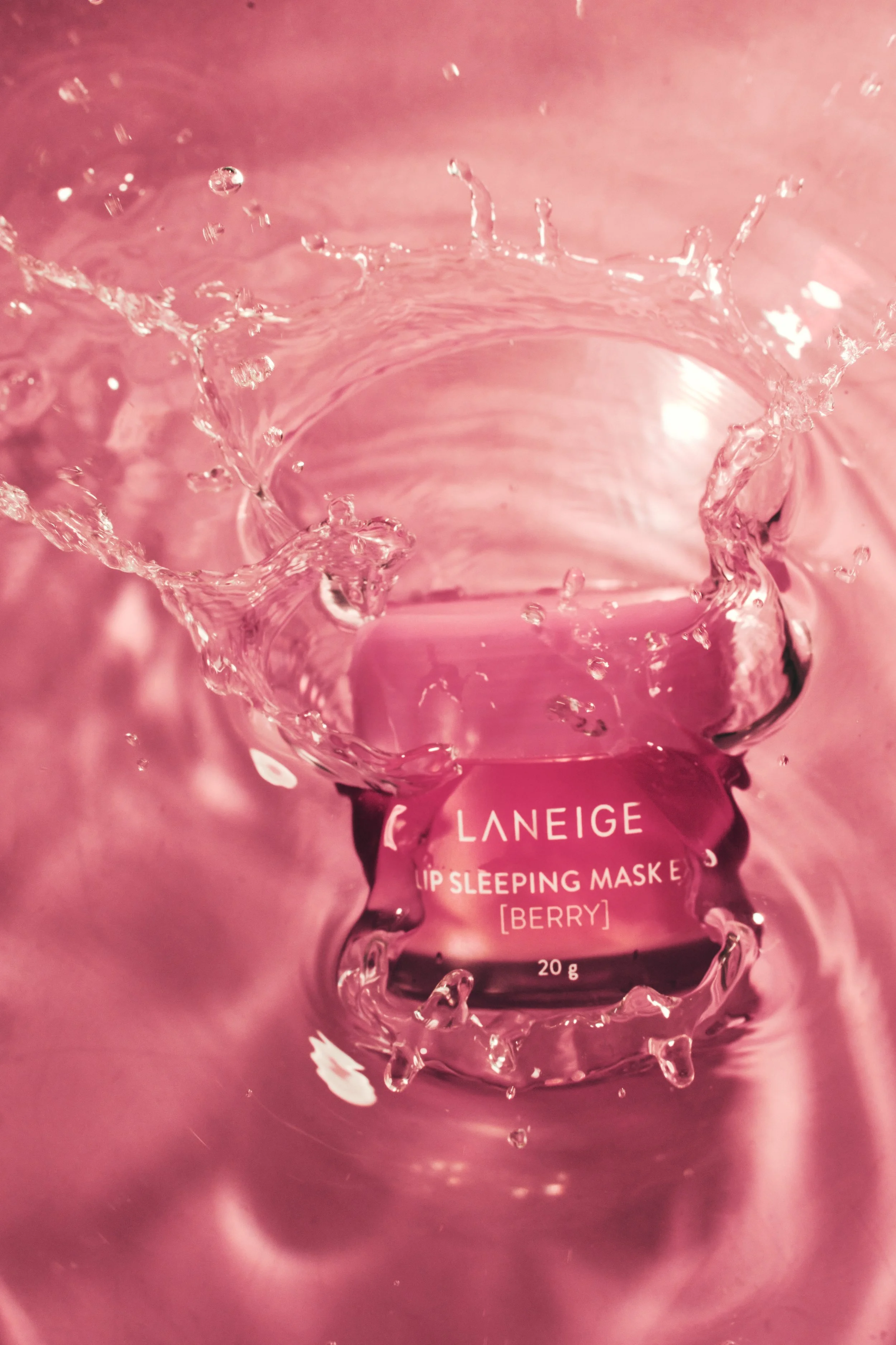 Pink container of Laneige Lip Sleeping Mask with water splash. JSnaps Product Photography E-commerce Commercial Photography New York City 