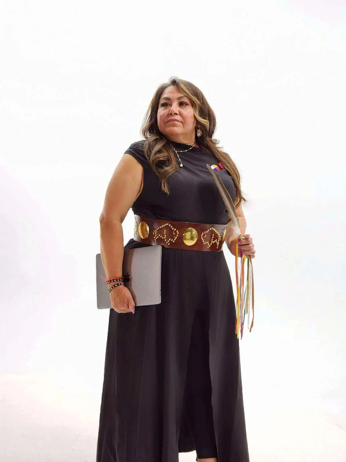 Corey-Ann-looking-in-distance-with-laptop