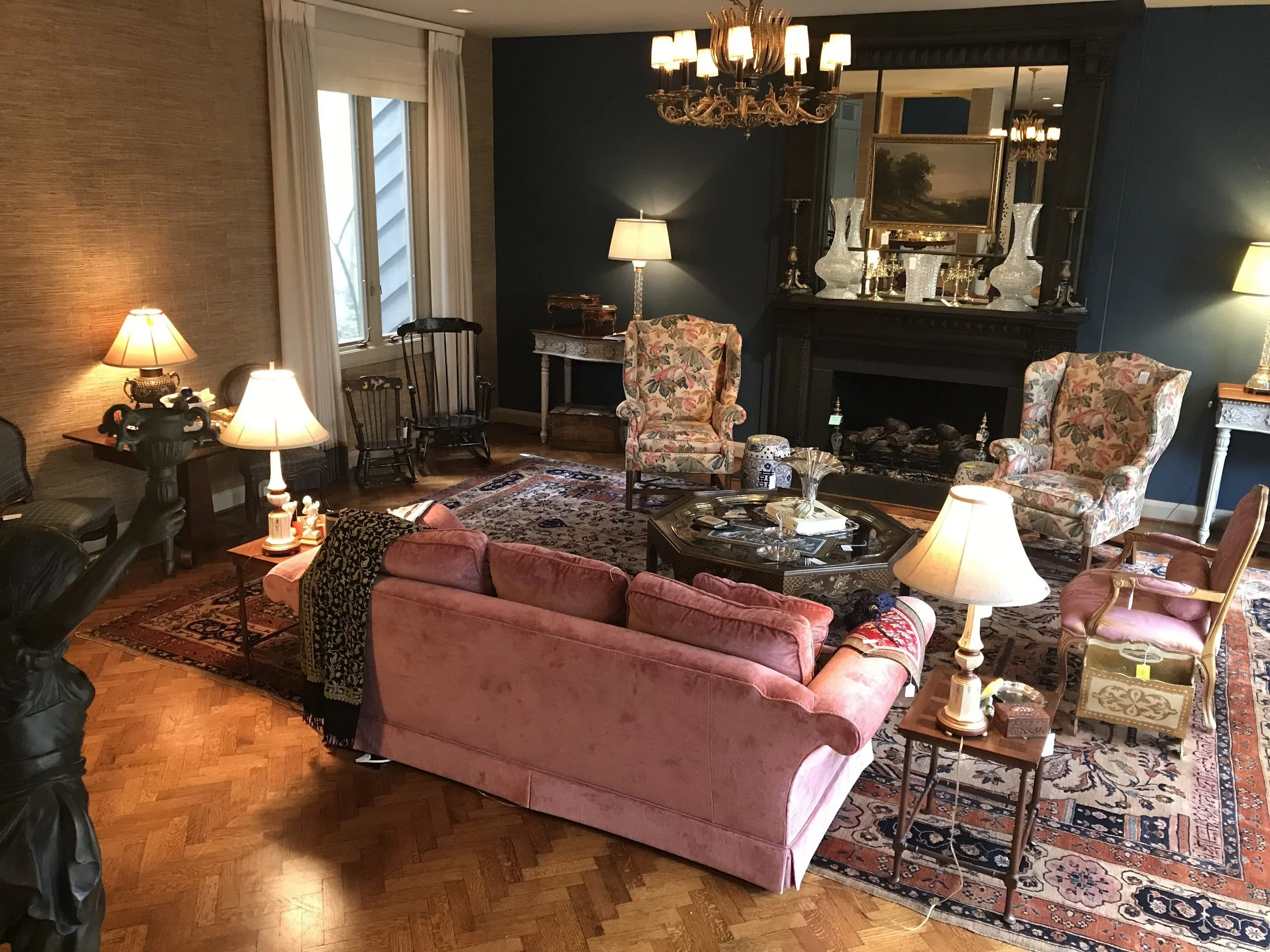 Living room furniture and décor arranged for a Southern Legacy estate sale