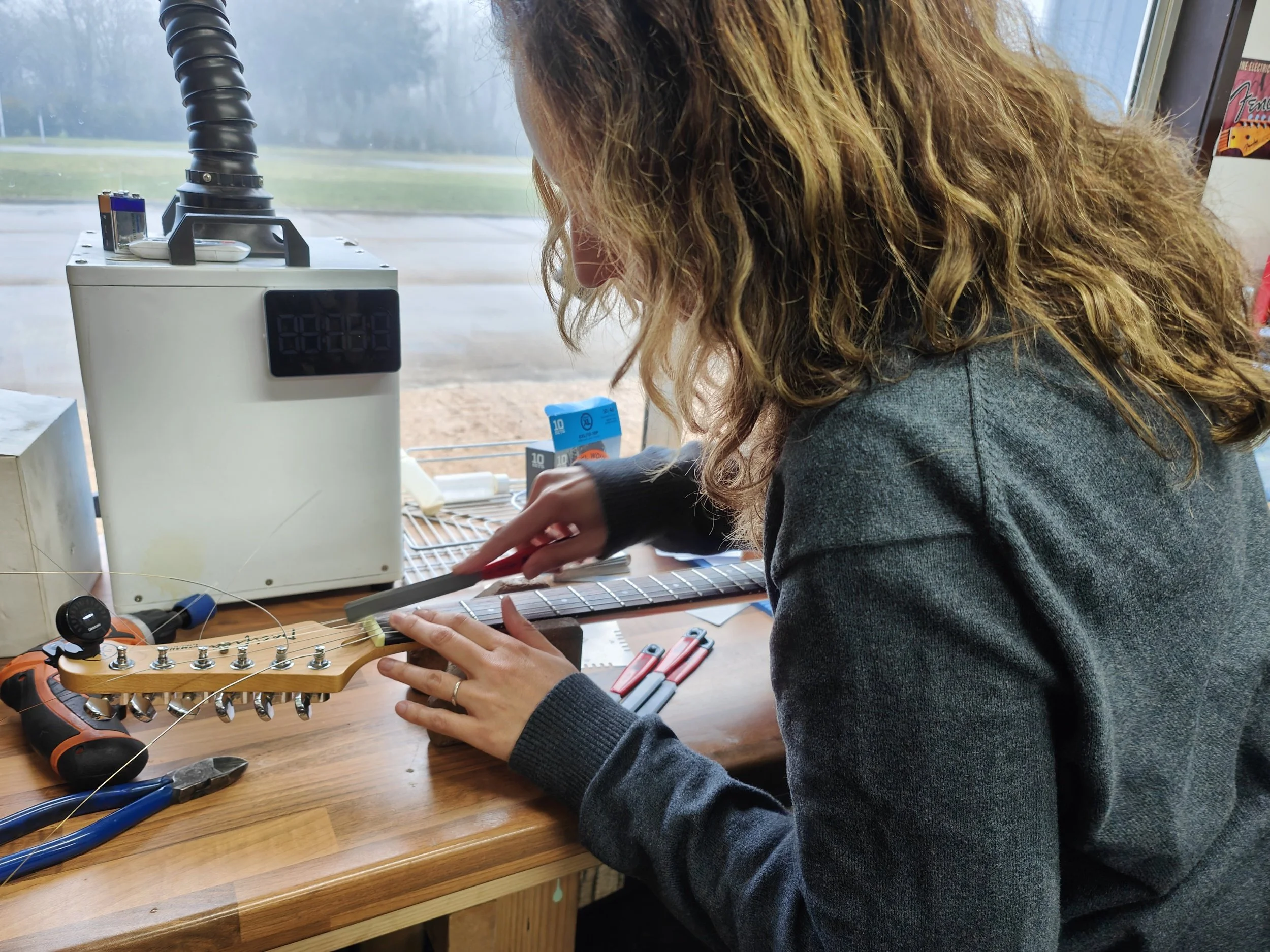 Cutting nut slots with stewmac files, on our pro setup course