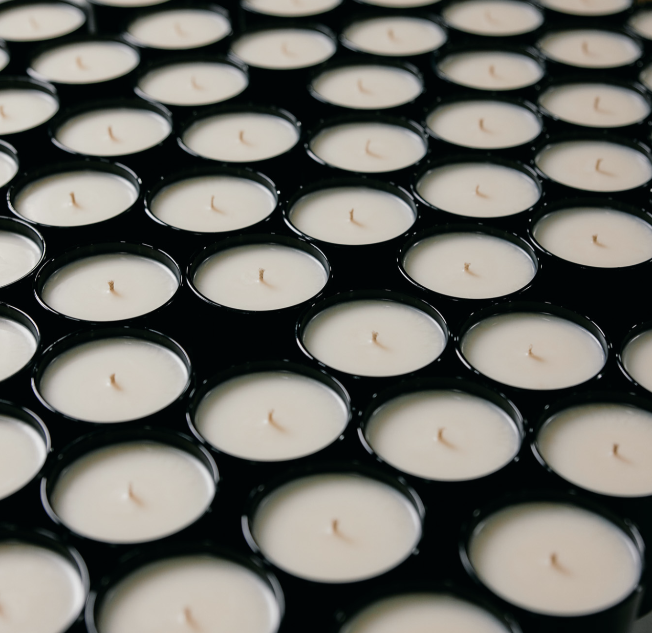 candle pouring factory showing generic poured vessels