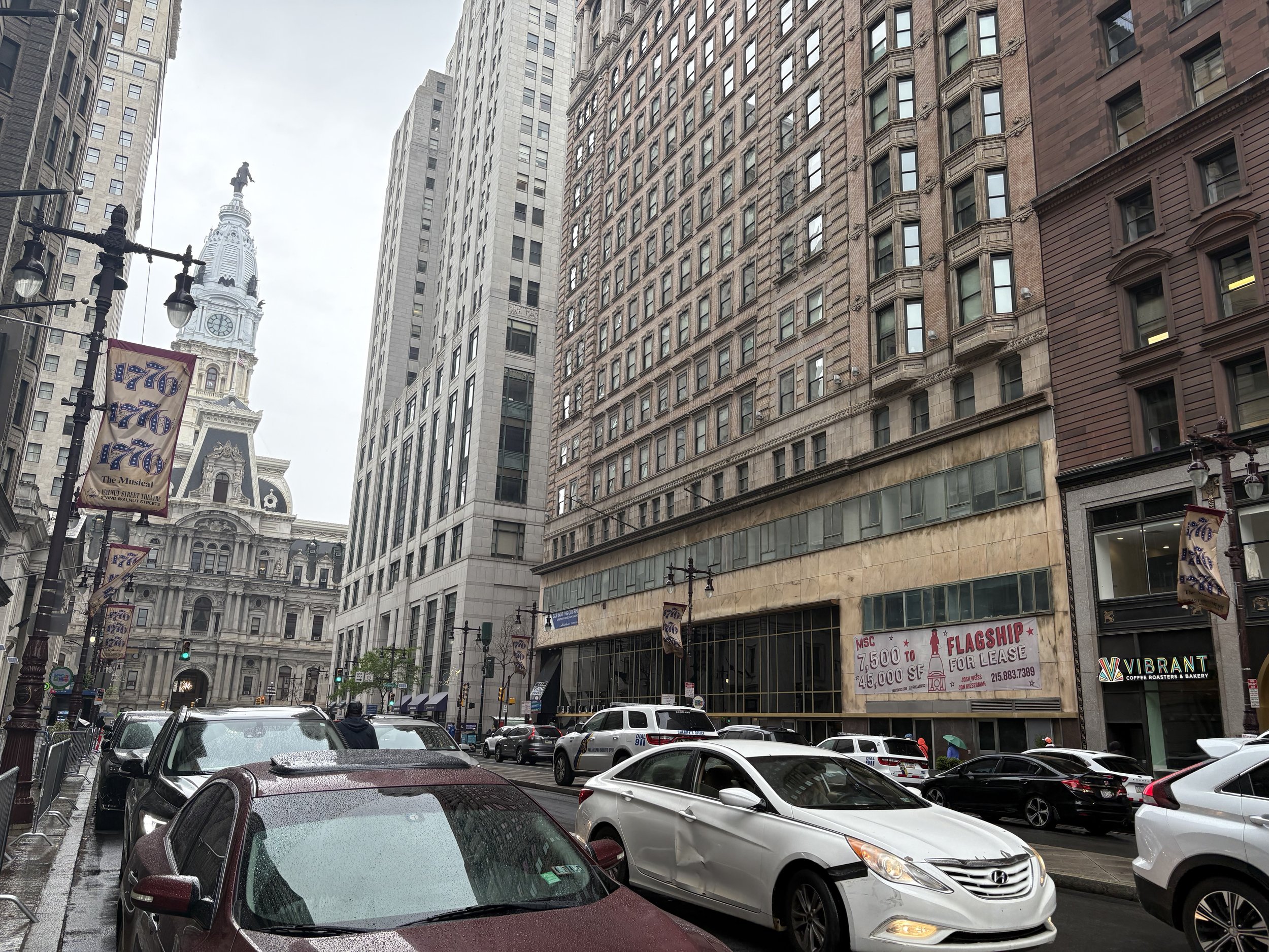 A view down Broad Street, showing the banner along with inspiration for the center of the design, the William Penn statue on top of City Hall, using our pink bear mascot instead.
