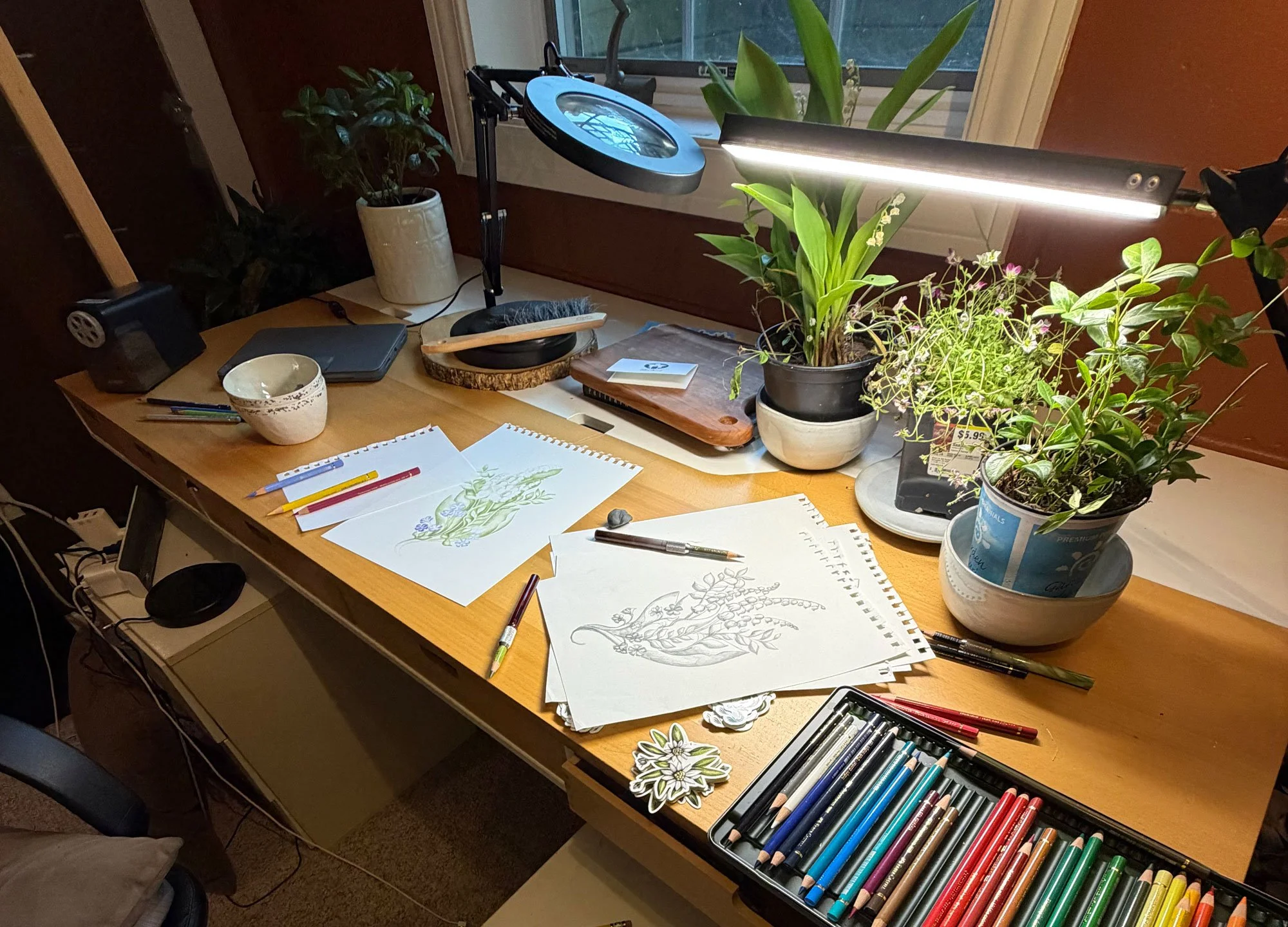 A desk with colored pencils