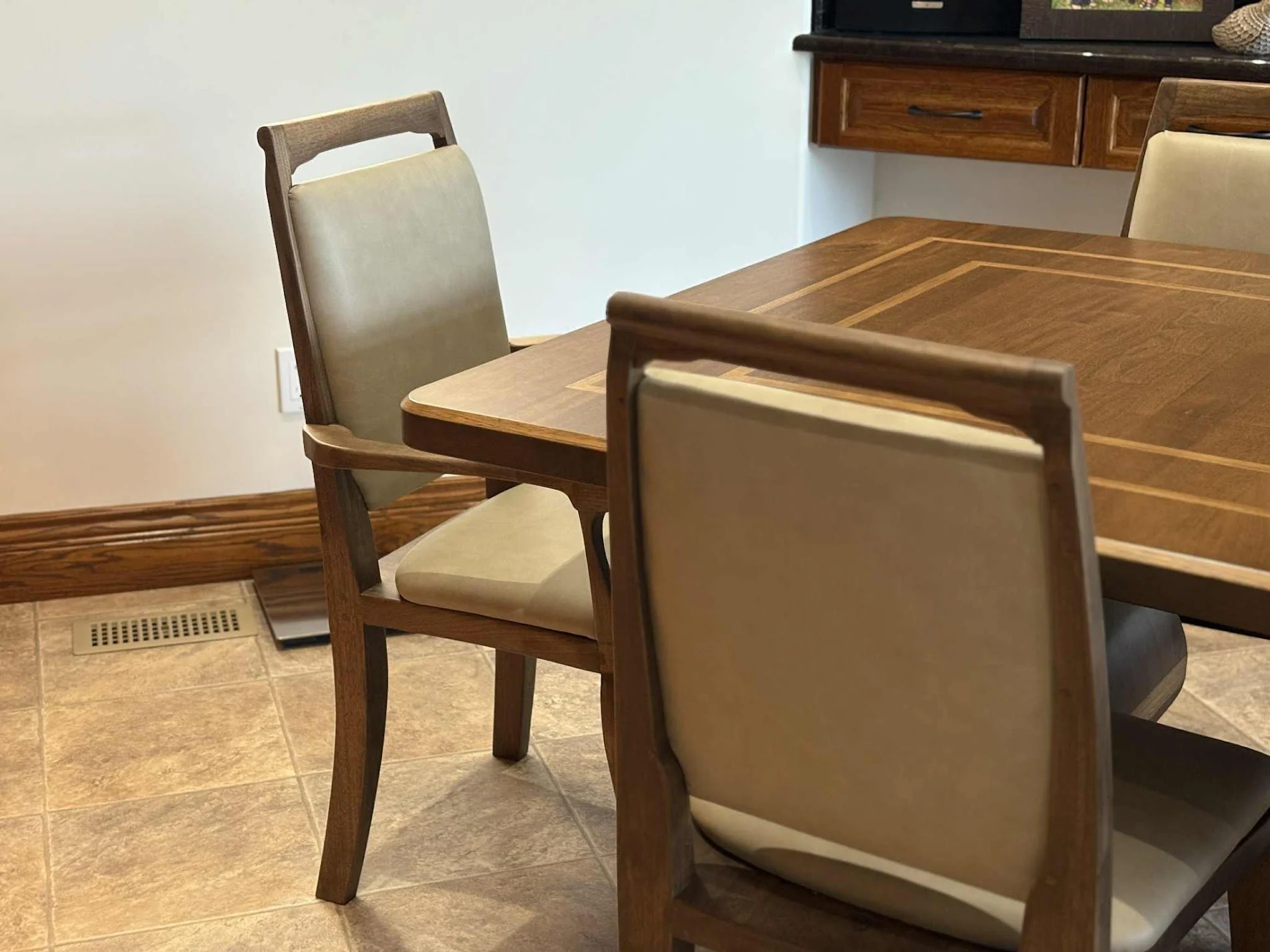 Artesão Windsor armchair in walnut with Ultraleather upholstery, front-angle view