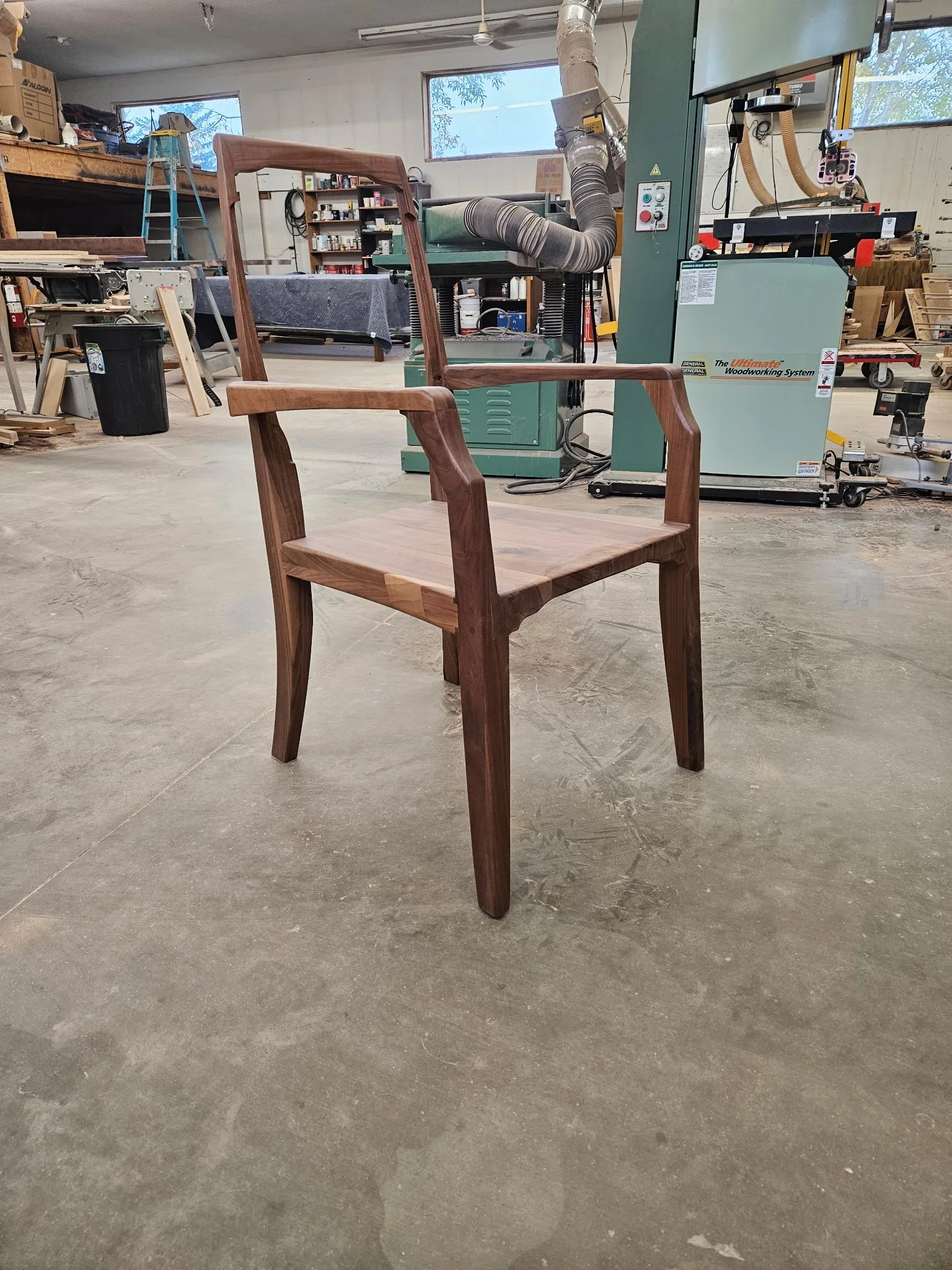 Artesão Legacy walnut dining armchair frame in the workshop