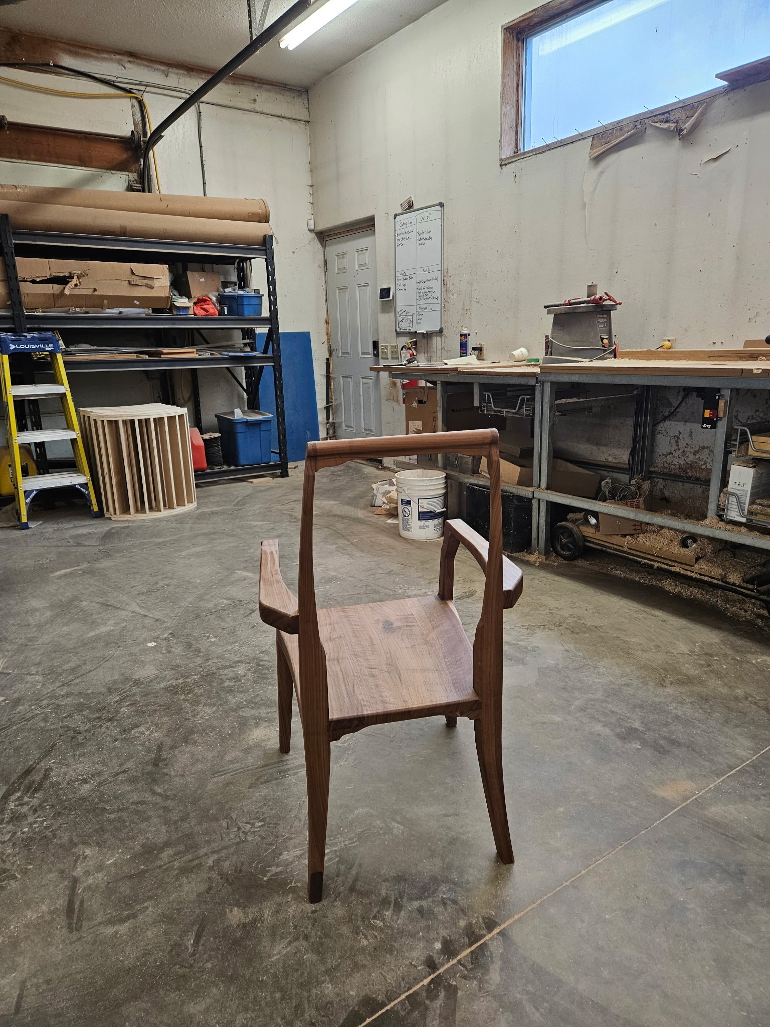 Artesão Legacy walnut dining armchair frame in the workshop