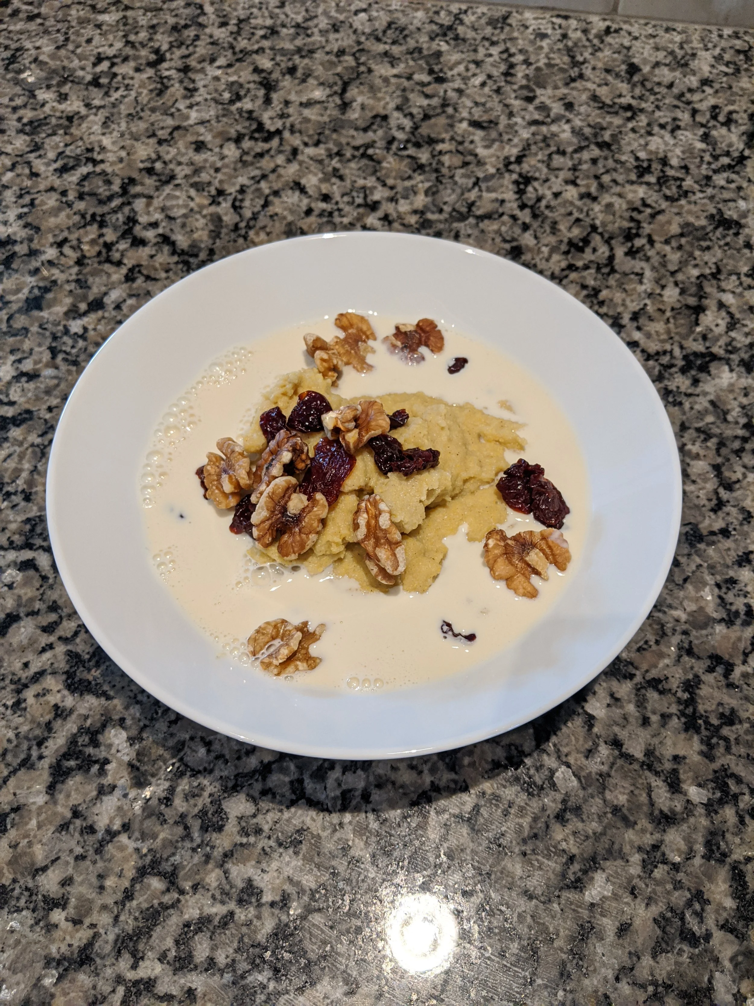 cornmeal porridge with dried cranberries and nuts