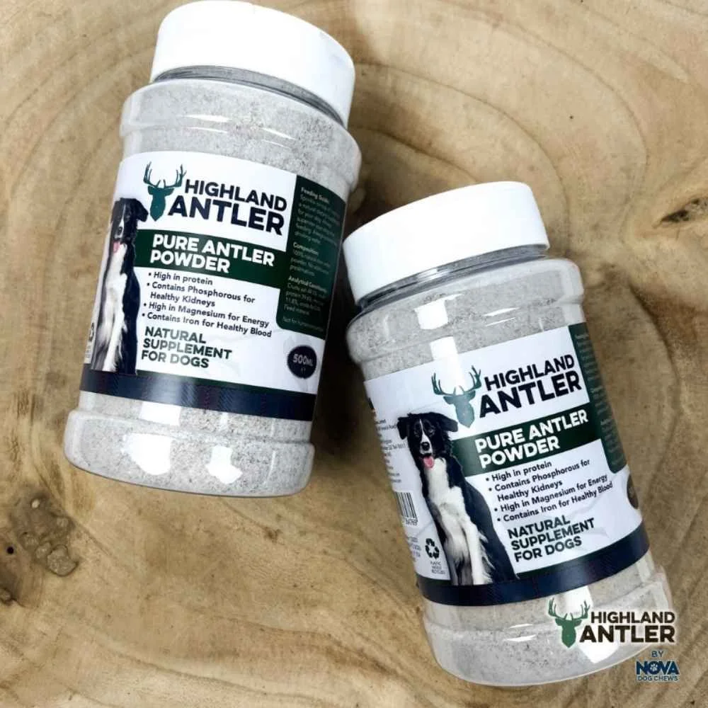 Two shaker jars of Nova Highland Antler Pure Antler Powder dietary supplement placed flat on a rustic wooden log slice.