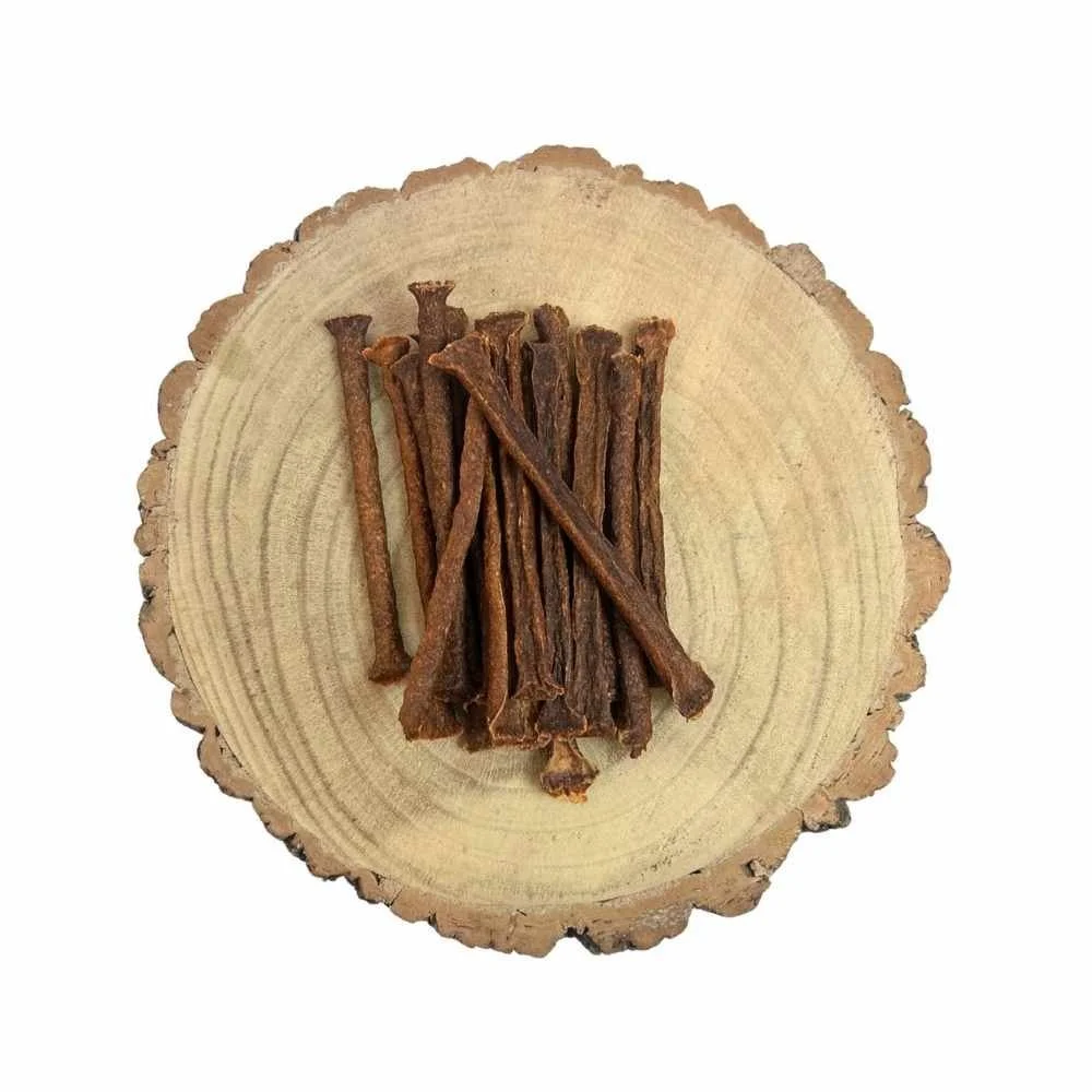 A bundle of Paddock Farm exotic kangaroo muscle meat sticks stacked together in the centre of a rustic wood slice background.