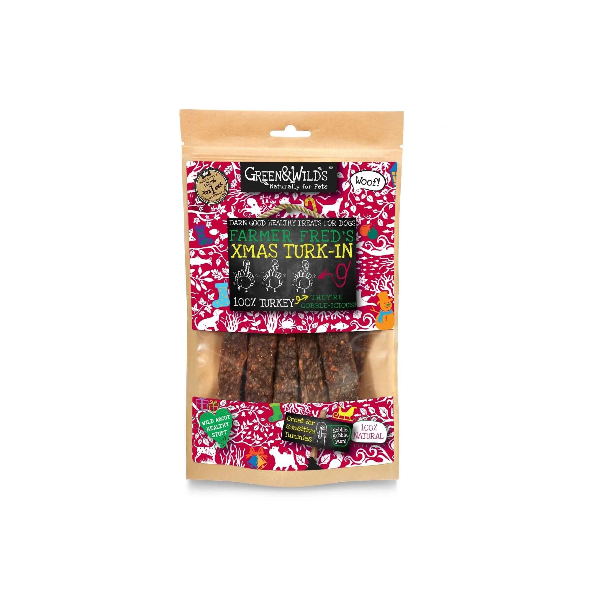 Resealable kraft paper pouch of Green & Wild's Xmas Turk-In 100% turkey dog treats with pink festive packaging, shown against a white background.