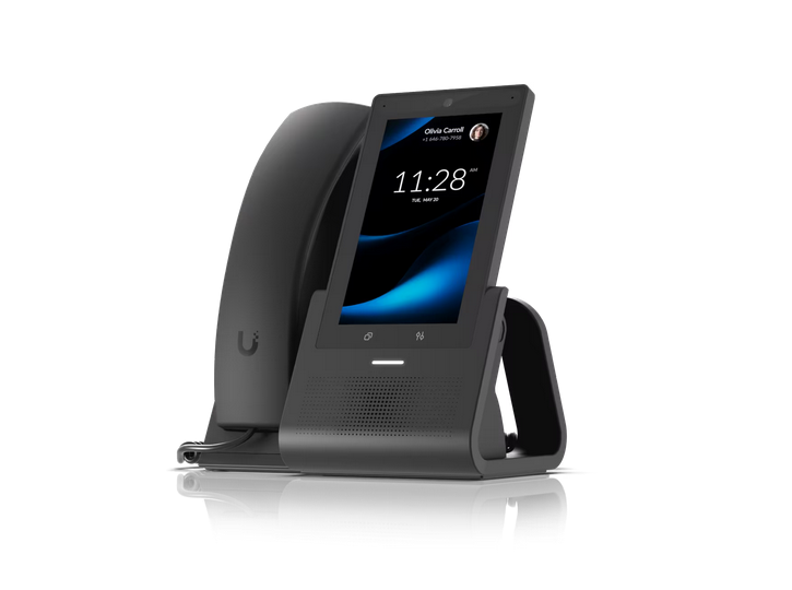 Smart speaker with a touchscreen display on a charging stand