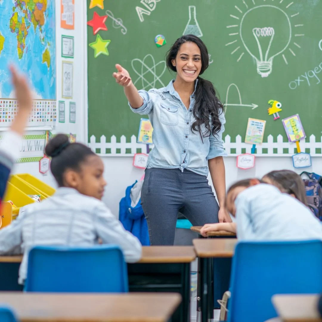 Teacher helping students in class