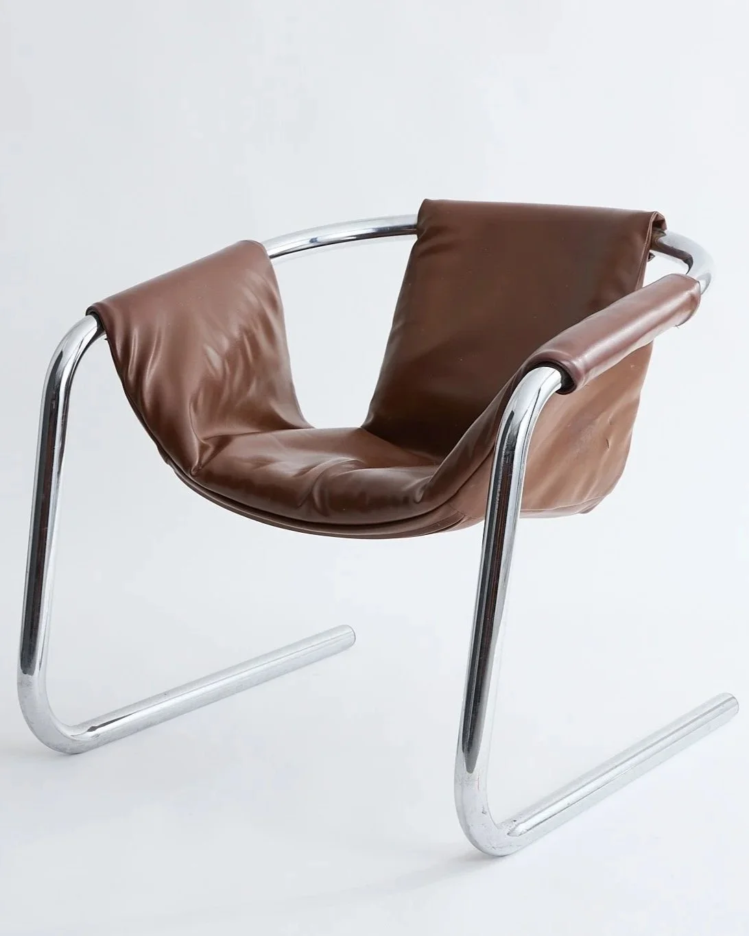 BROWN LEATHER SLING CHAIR, $250,
H27" X W28" X D28"