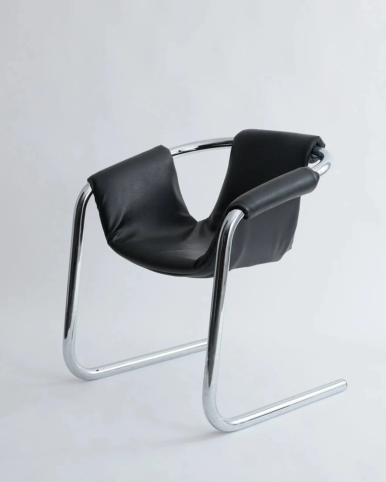 BLACK LEATHER SLING CHAIR, $250,
H30" X W25" X D34",
2 AVAILABLE