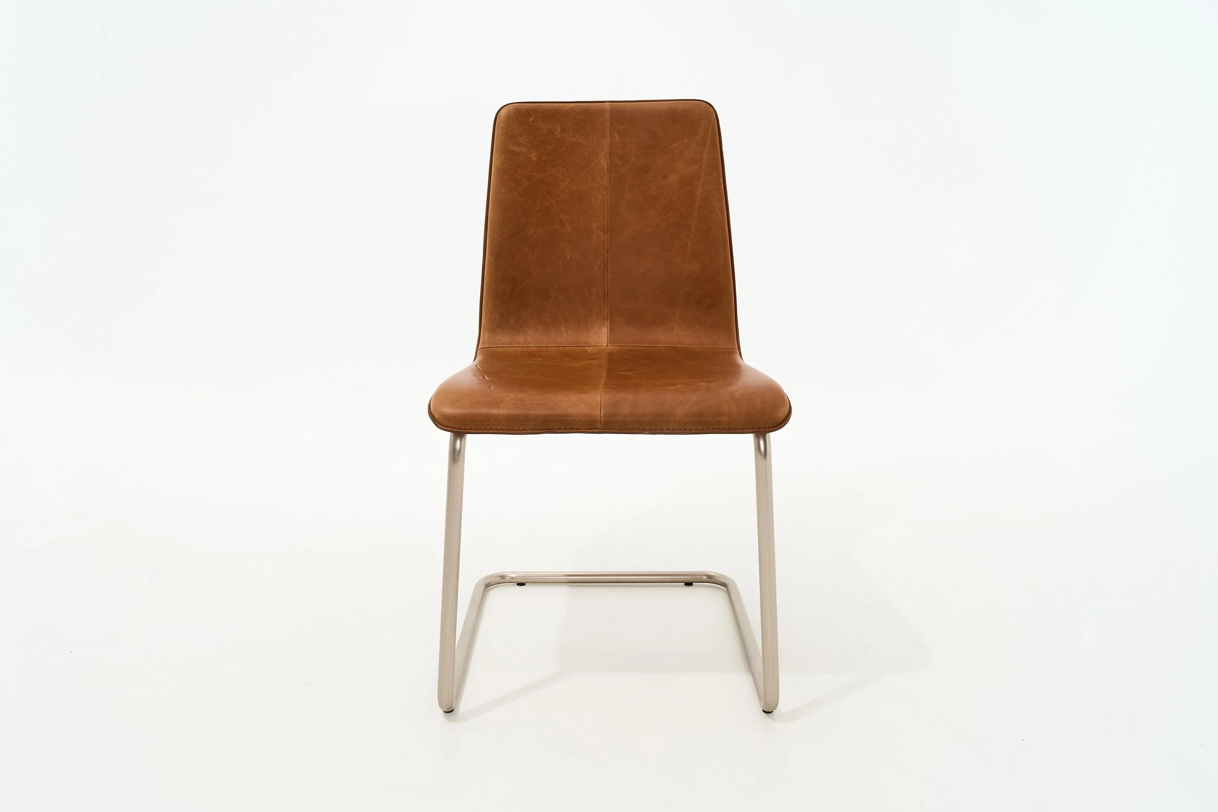 MOLDED COGNAC LEATHER CANTILEVER CHAIR, $105, H34" X W19" X D19", #00161, SINGLE