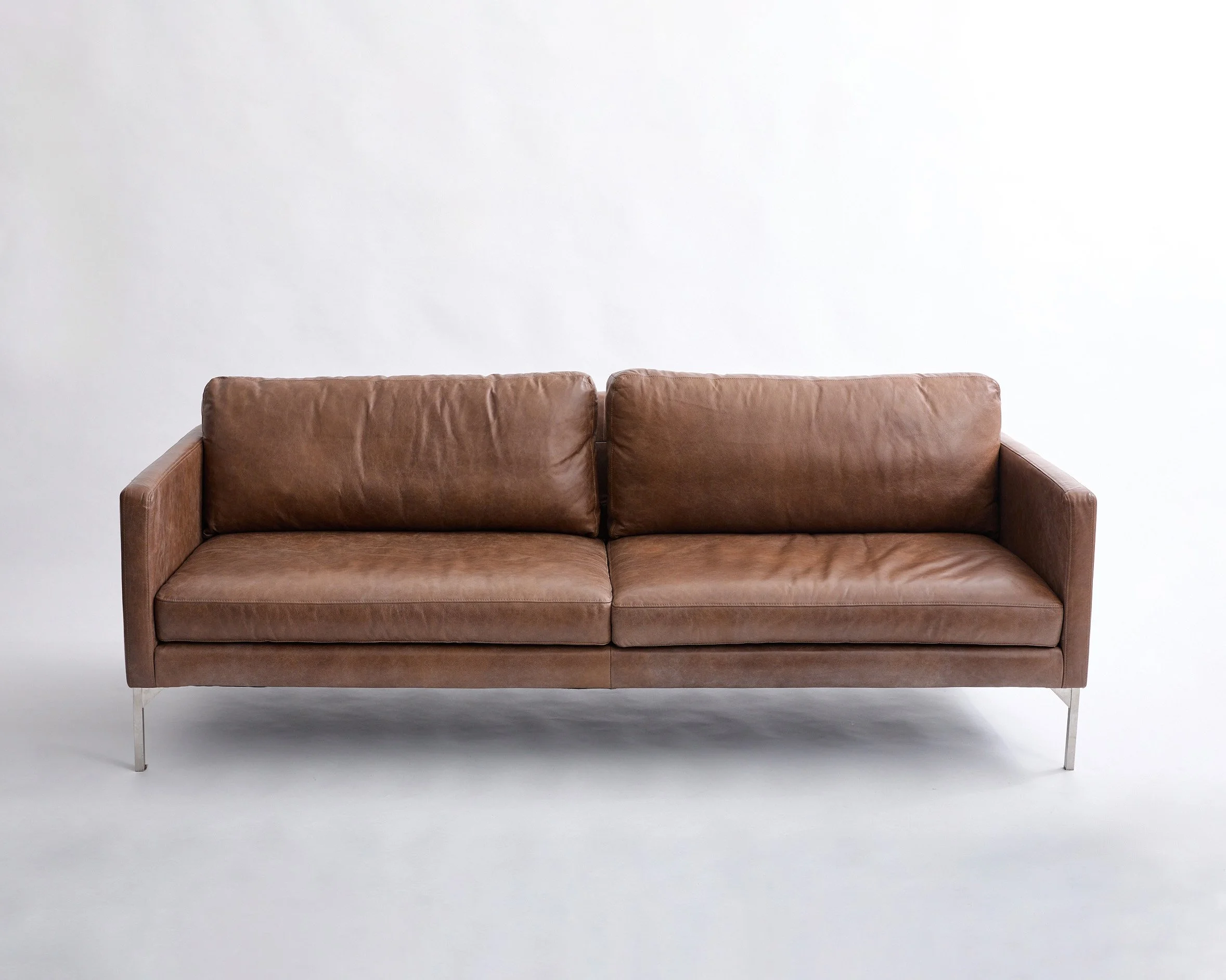 BROWN LEATHER SOFA, $600, H30" X W84" X D36", Single