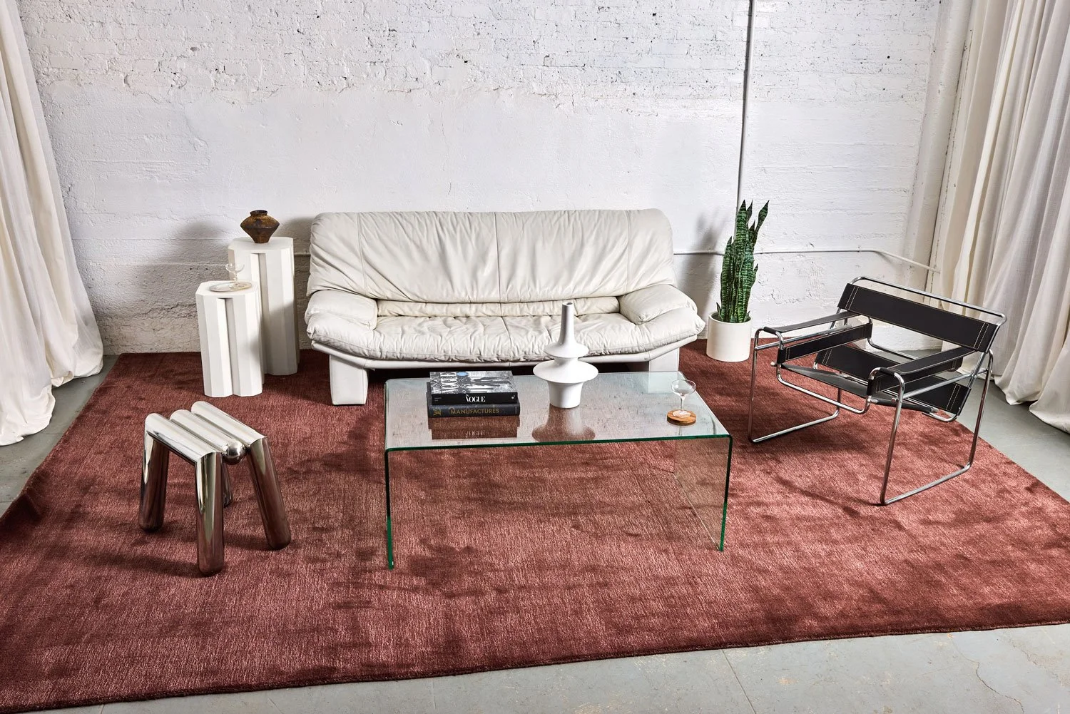 Tangerine-prop-shop-furniture-lounges-red-carpet-white-couch.jpg