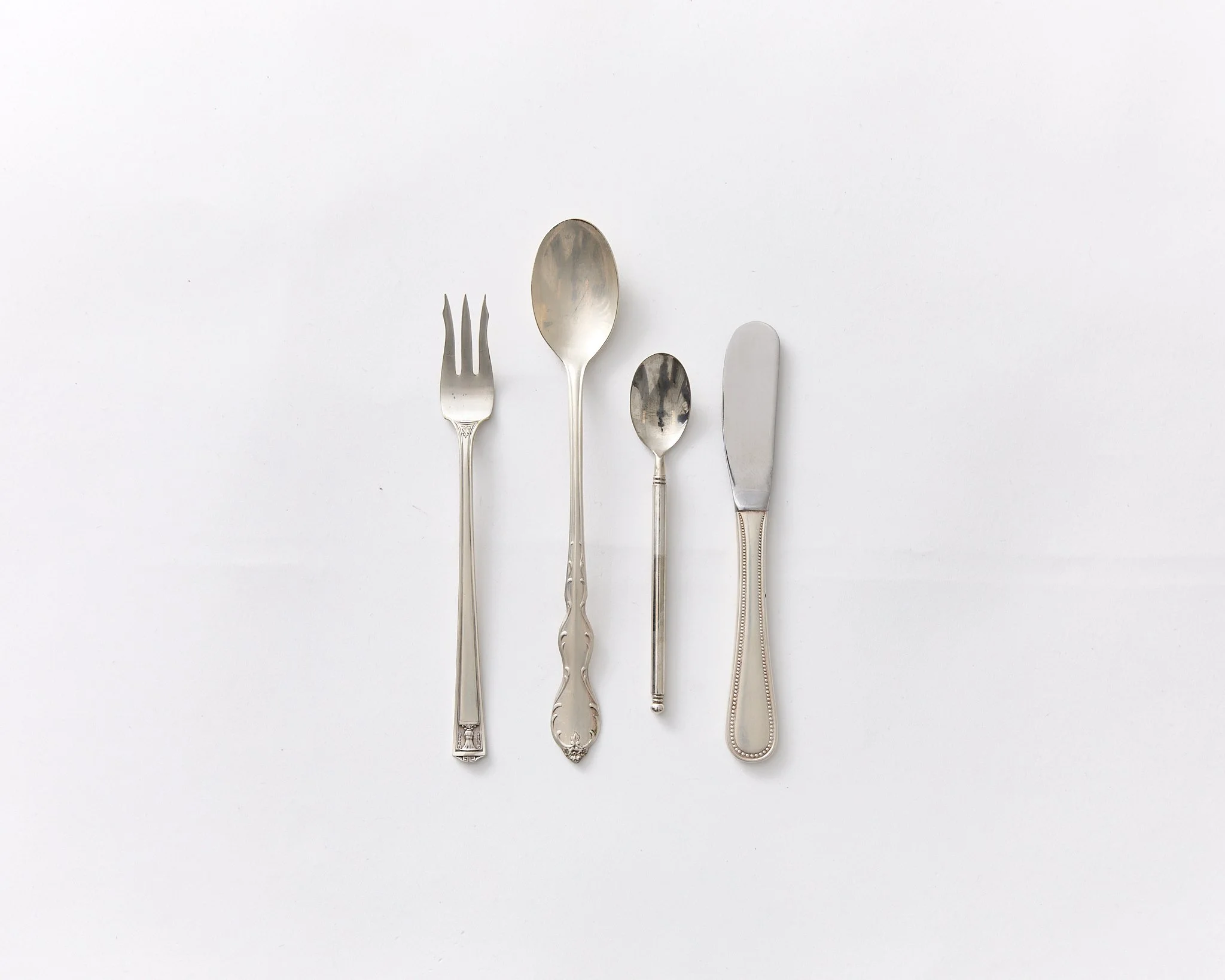 OYSTER FORK, SUNDAE SPOON, TEASPOON & BUTTER KNIFE, 200 TOTAL, $2 EACH (MIXED STYLES OF VINTAGE SILVER-PLATED FLATWARE)