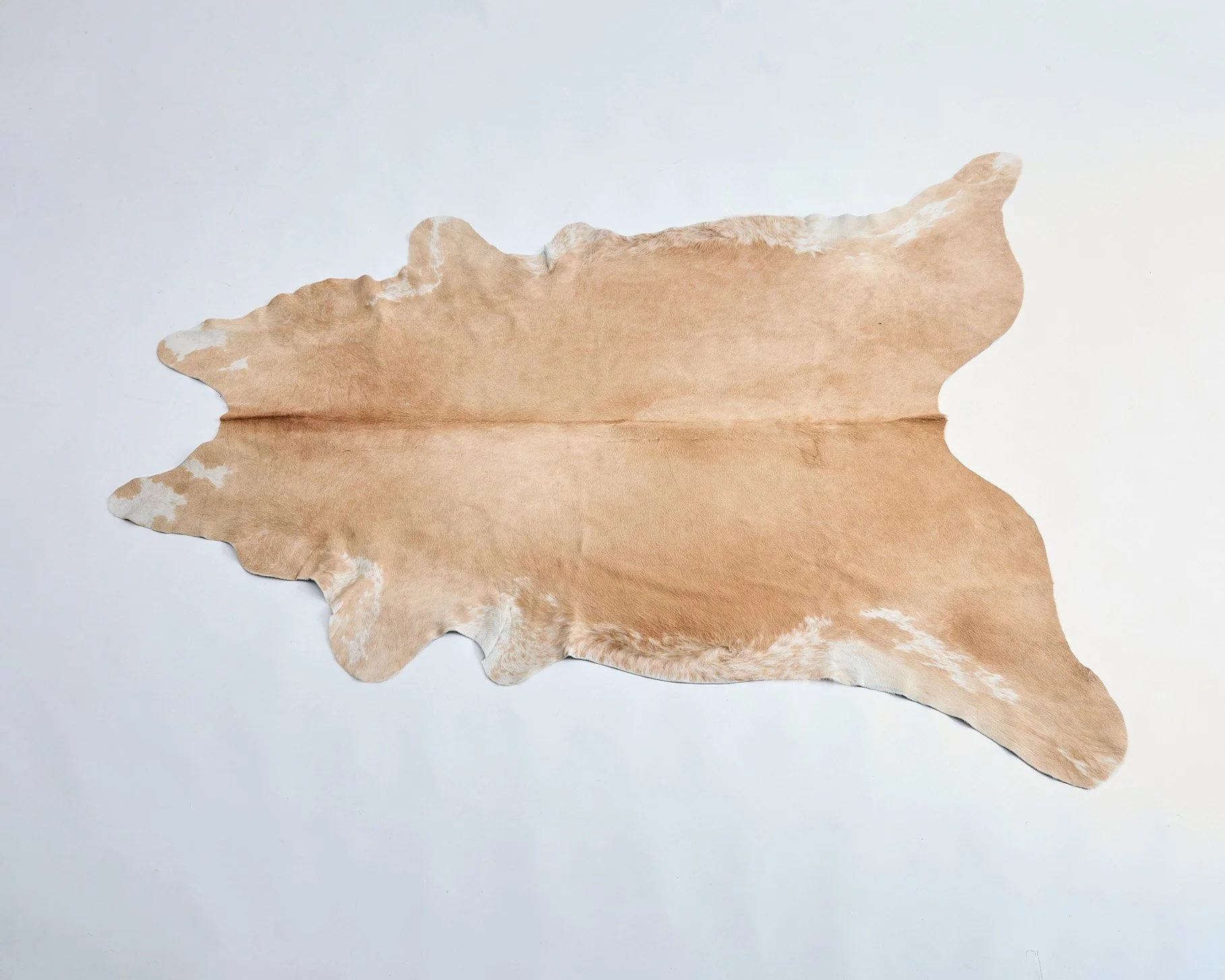 COWHIDE RUG, $100, 80" X 90”